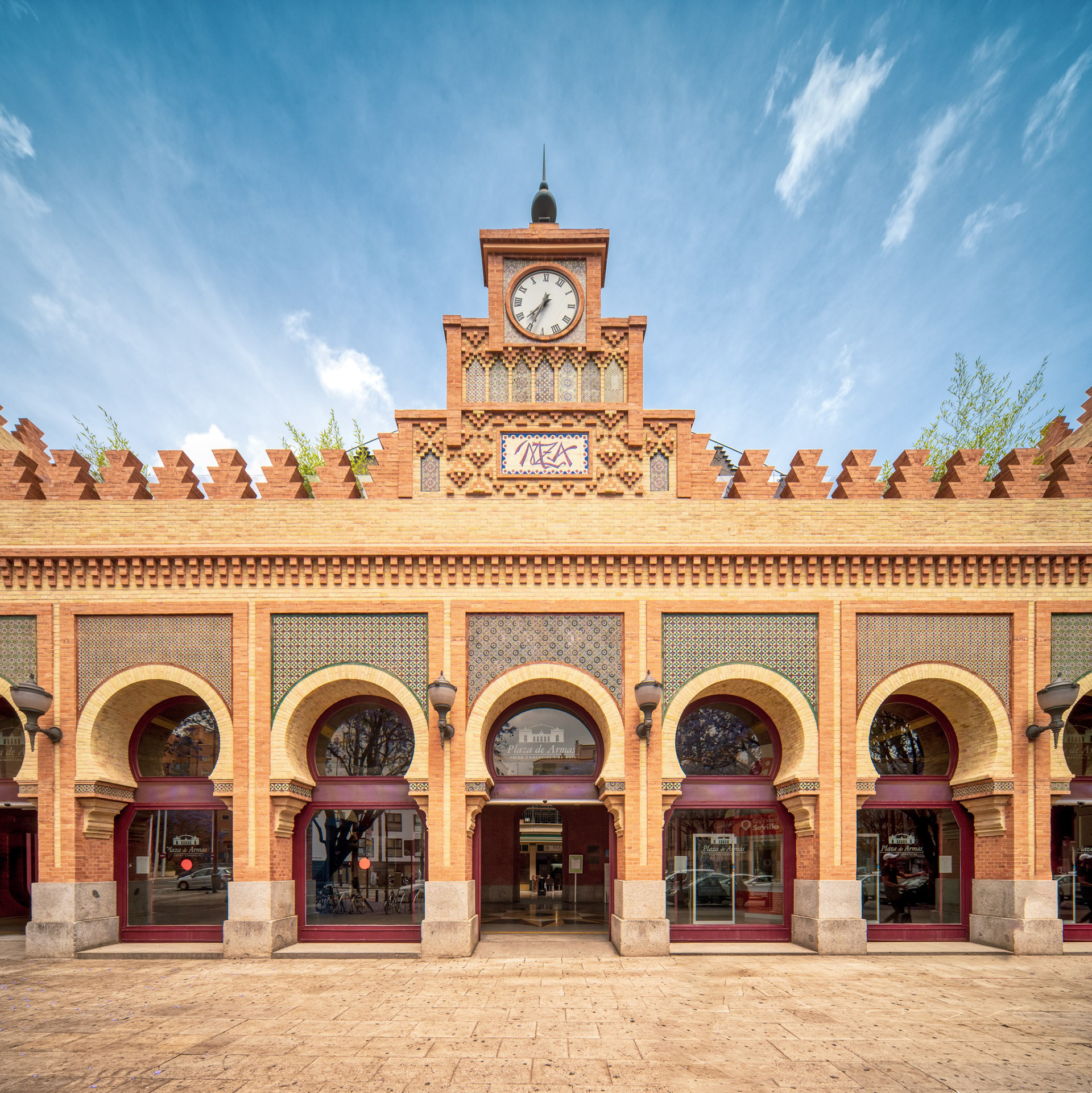 Featuring the Neo-Mudejar facade of Antigua Estacion de Plaza de Armas in Seville, Spain