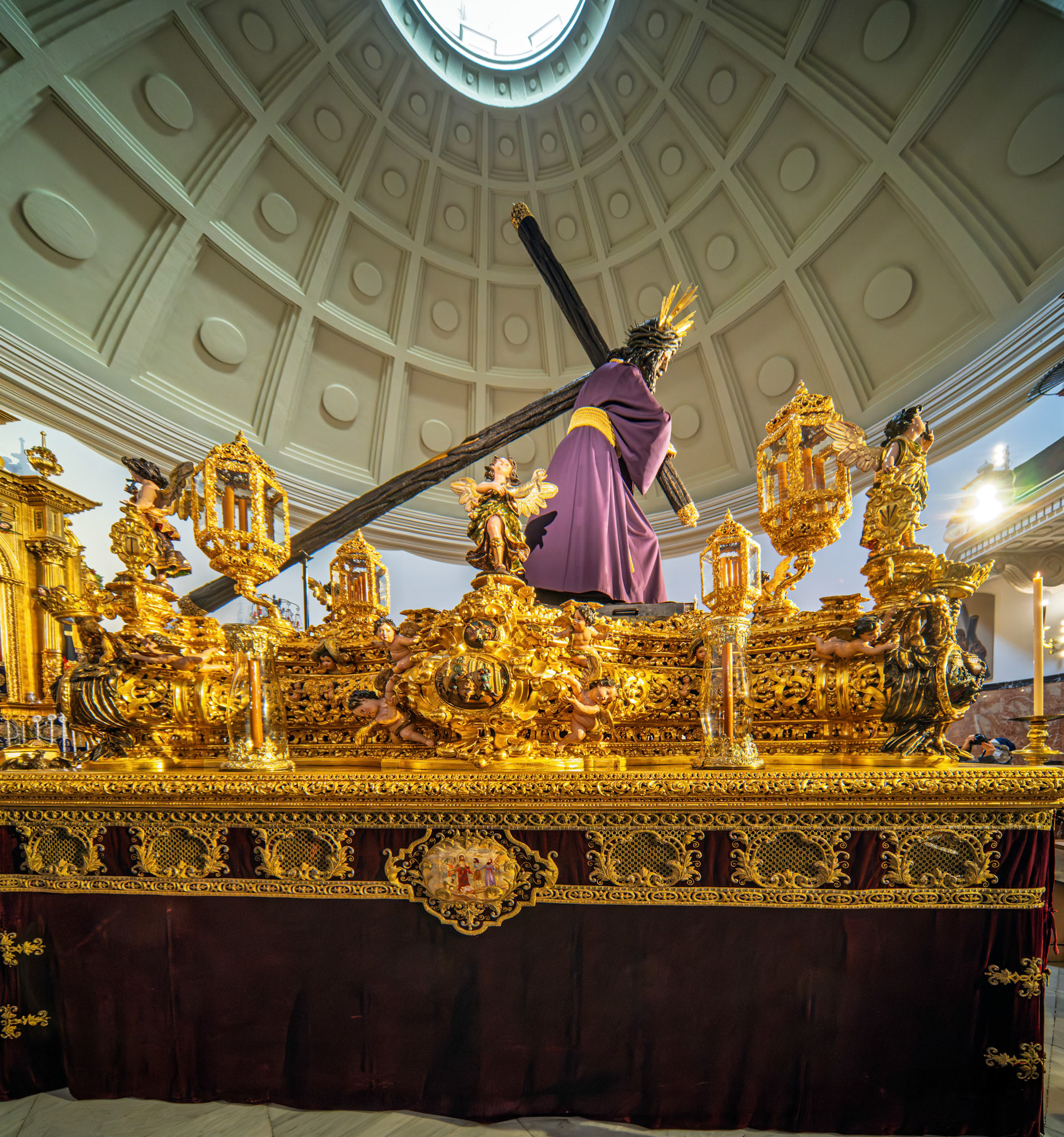 Jesús del Gran Poder on its ornate processional float under the basilica's dome. Prepared for the Good Friday dawn procession in Seville, Andalusia, Spain.