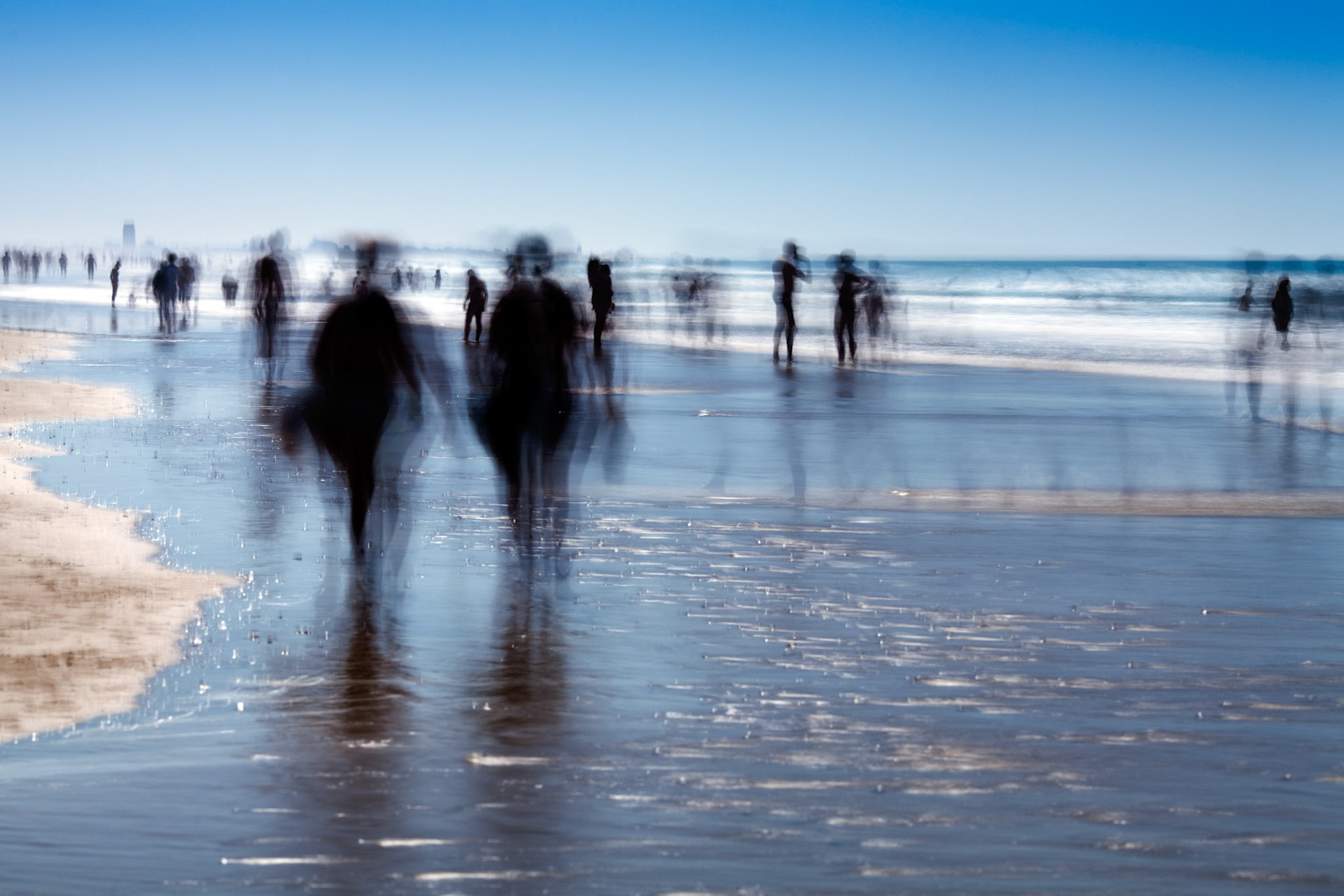 People on the beach. Daylight long exposure shot by the use of neutral density filters.