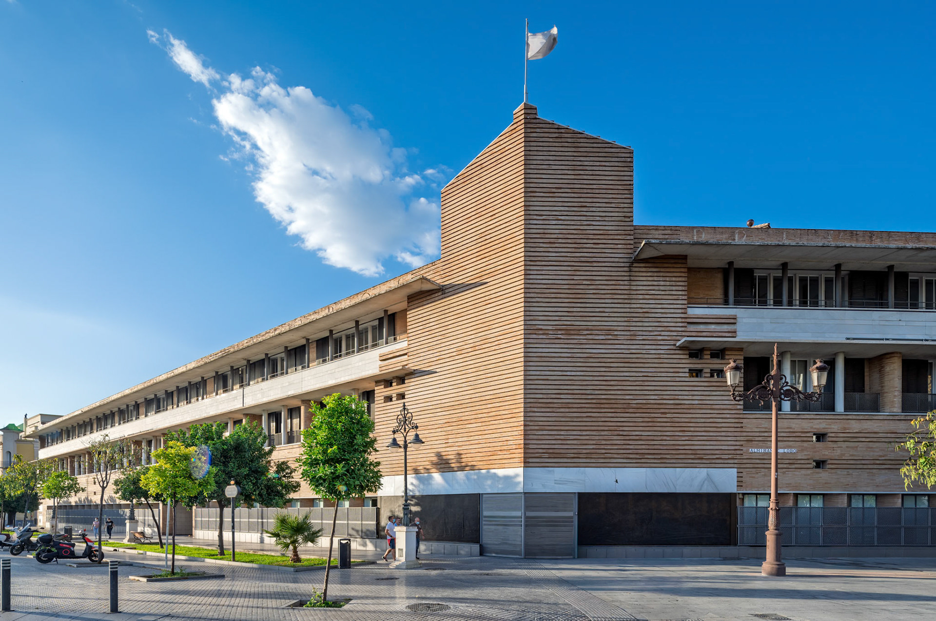 Building for Previsión Española, completed in 1987 by Rafael Moneo—horizontal brick and wood volumes echo Sevillian palatial rhythms with modern restraint