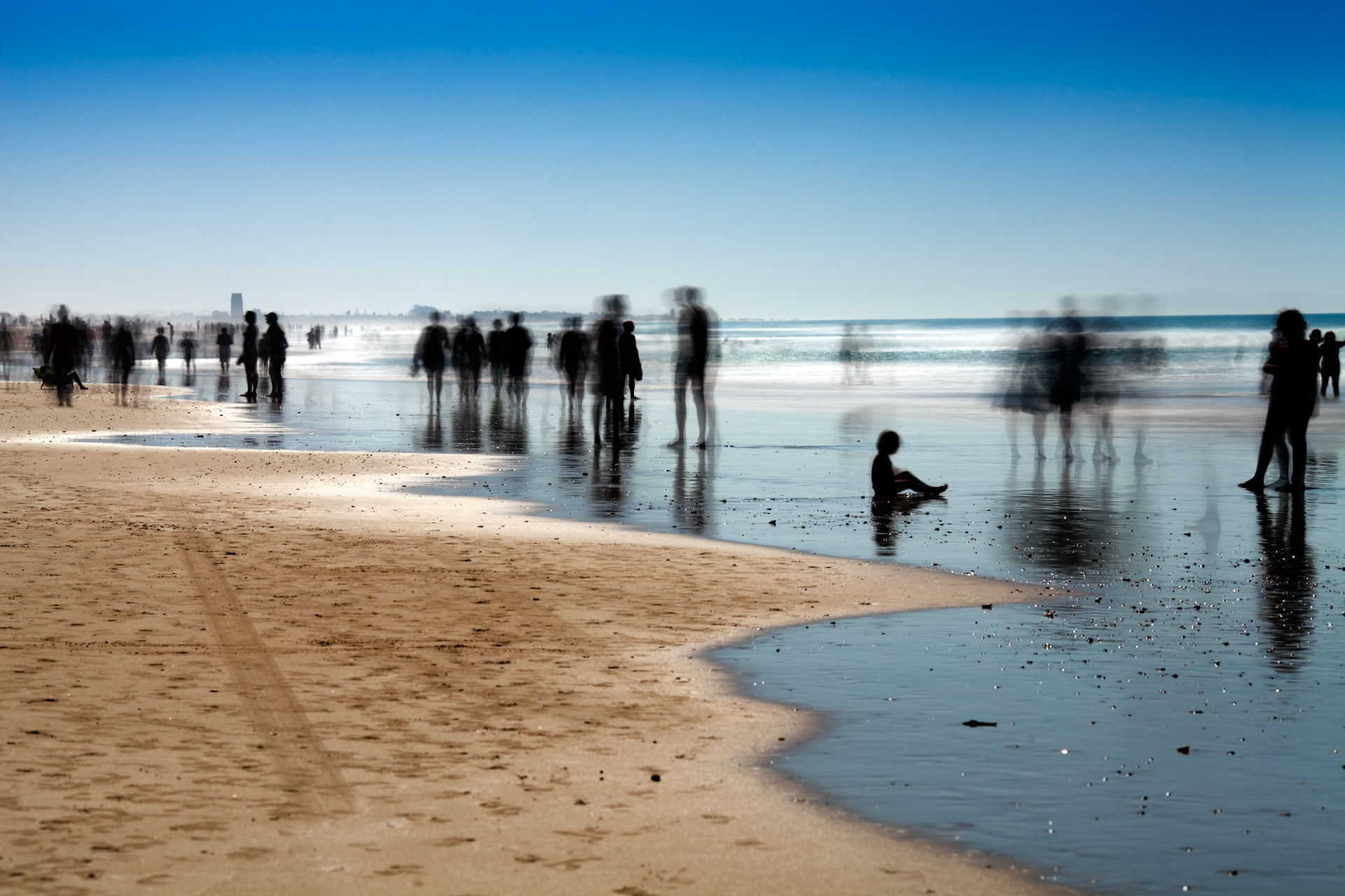 People on the beach. Daylight long exposure shot by the use of neutral density filters.