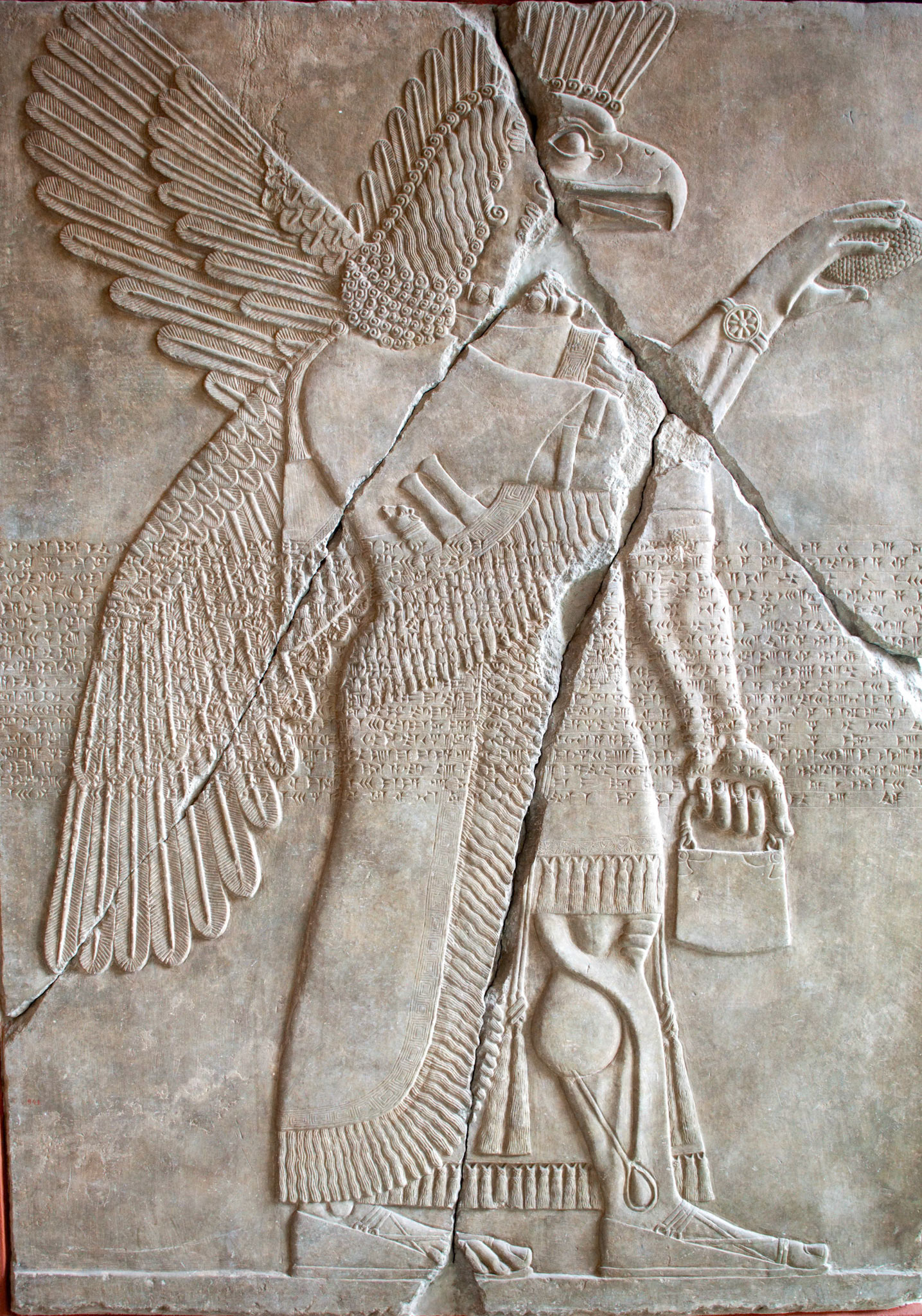 Berlin, Germany, July 24 2009, Explore the detailed Assyrian reliefs depicting winged divine beings at the Pergamon Museum in Berlin, showcasing ancient artistry.