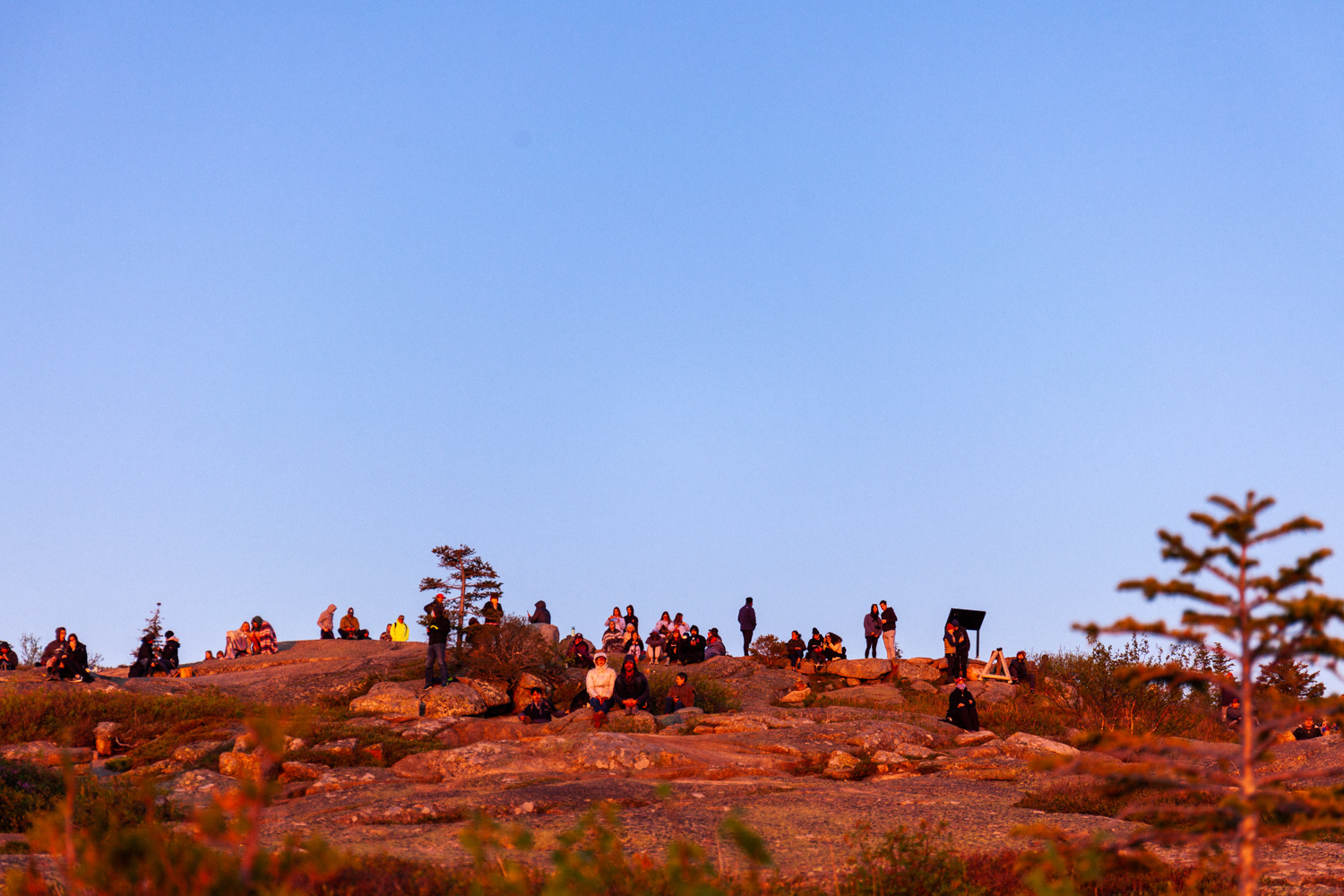 The crowd gathered on Cadillac Mountain peak to view the sunrise.