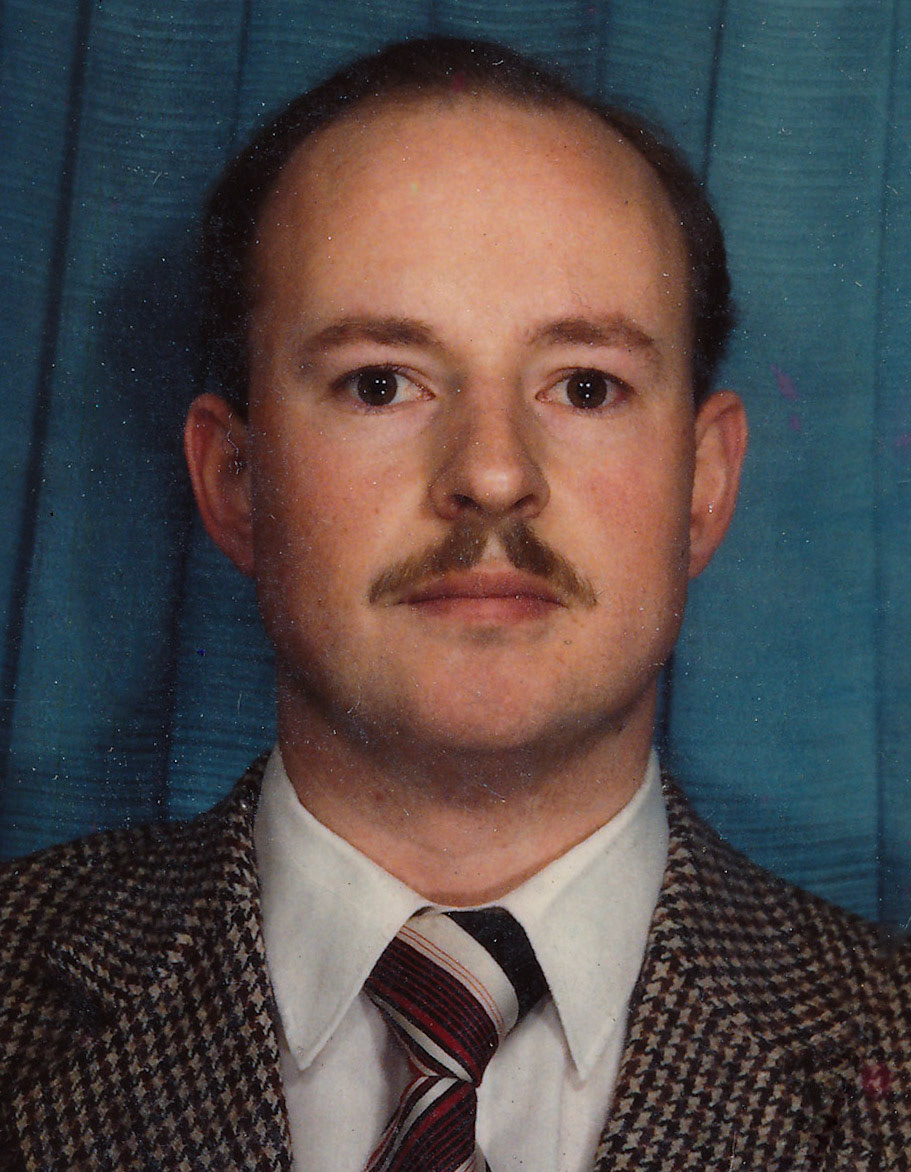 Howard's passport photo, all ready for the trips to Zambia then Kenya