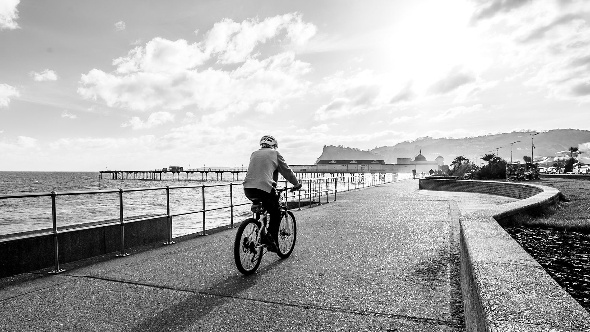 A cyclist on the promenade