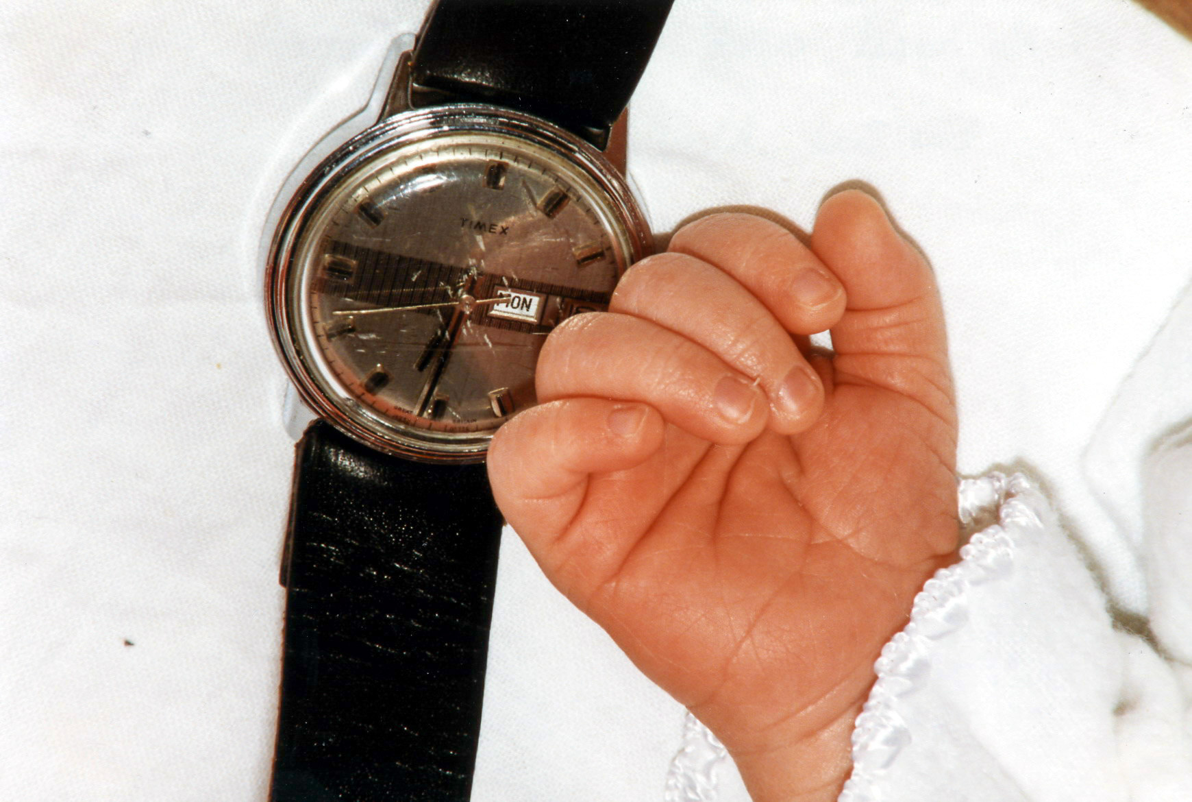 Jamie's hand. Howard's watch.