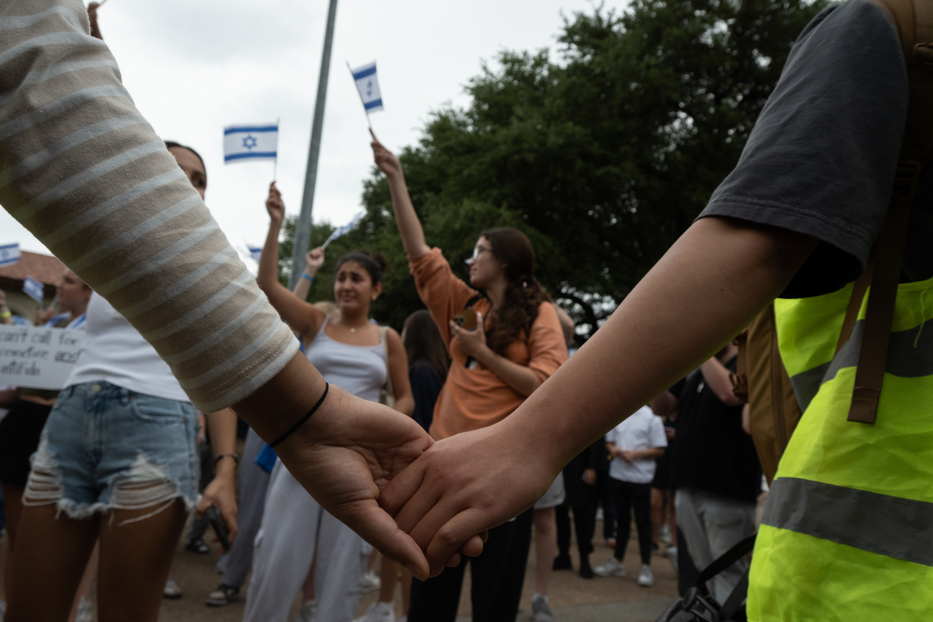 Counterprotesters waive Israel's flag at a rally held in response to the esclatation on the University of Texas at Austin's campus the day before, on Wednesday, April 24, 2024. The Palestinian Solidarity Committee partnered with campus faculty on April 25, 2024 to host a rally on Main Mall to support the 57 arrested and held in Travis County Jail overnight.