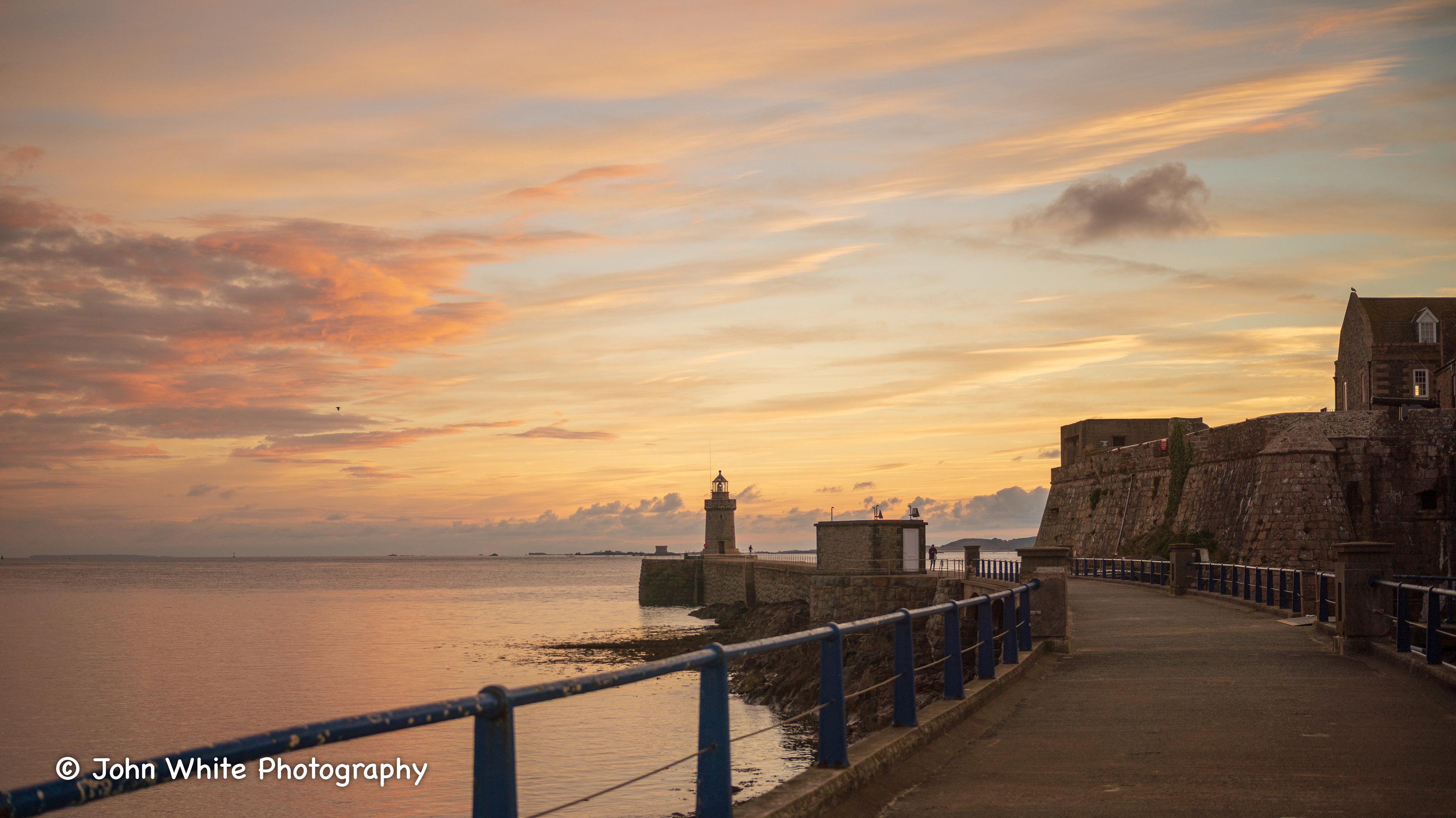 Lighthouse and Castle at Sunrise