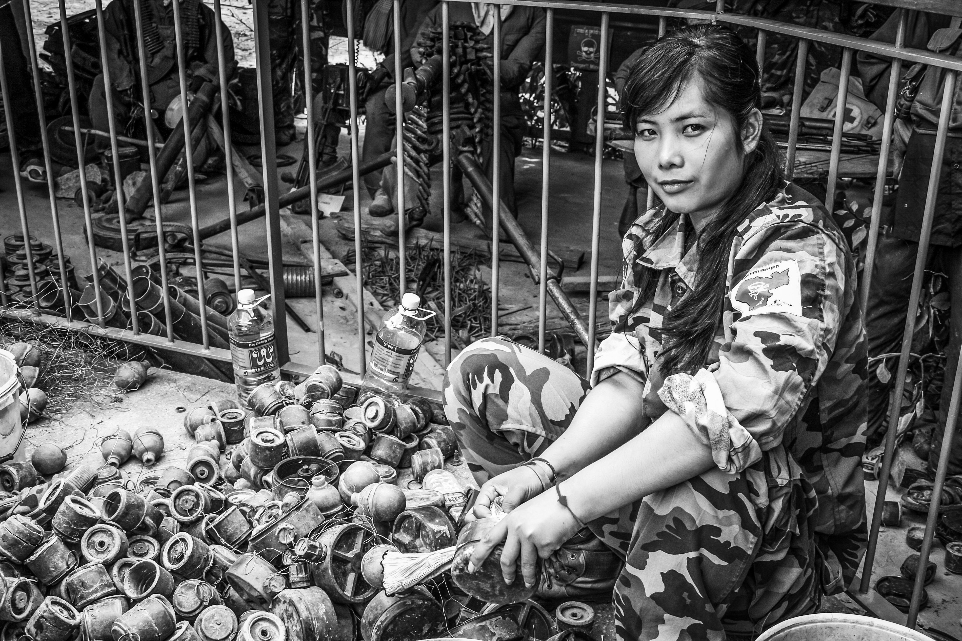 An army volunteer making sure the many land mines that have been found are safe.