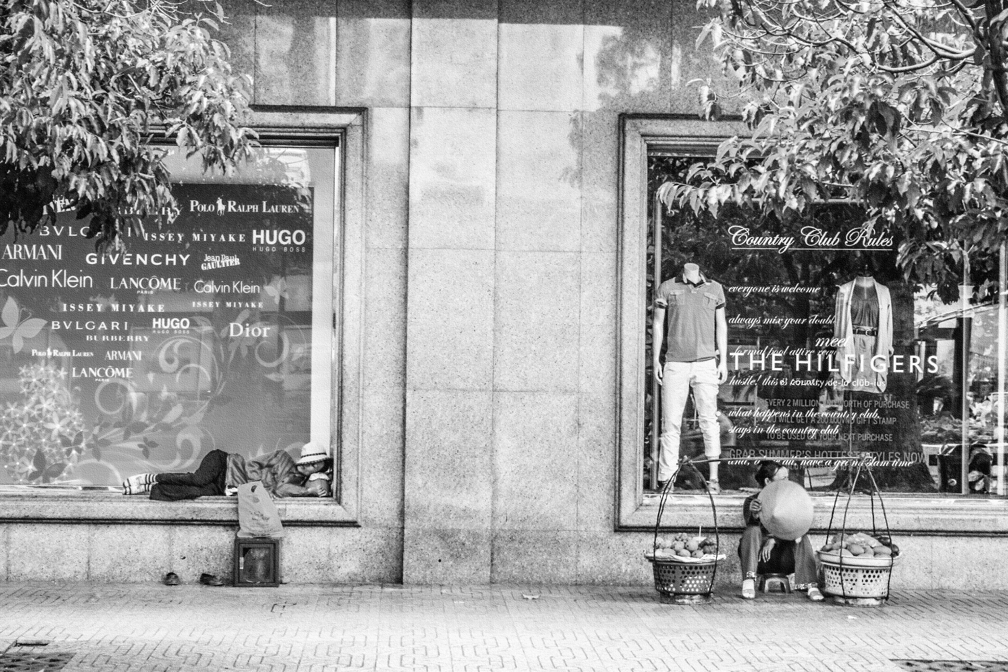 The windows of one of HCMC's swankiest shops is a great place for a nap.