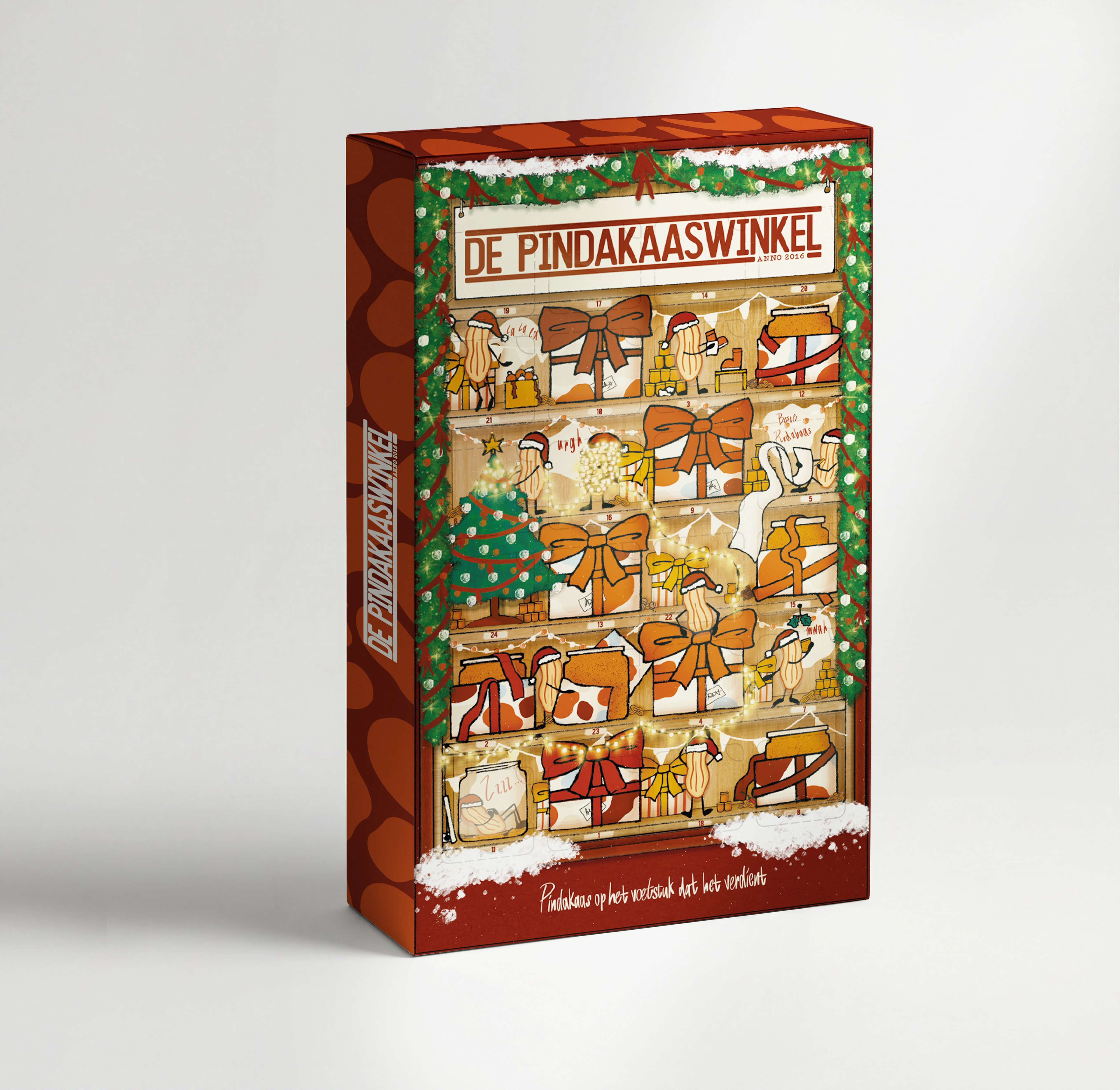 Front of the De Pindakaaswinkel Adventskalender showing a Christmas-themed peanut butter shop with jars, gifts, bows, snow, and festive greenery.