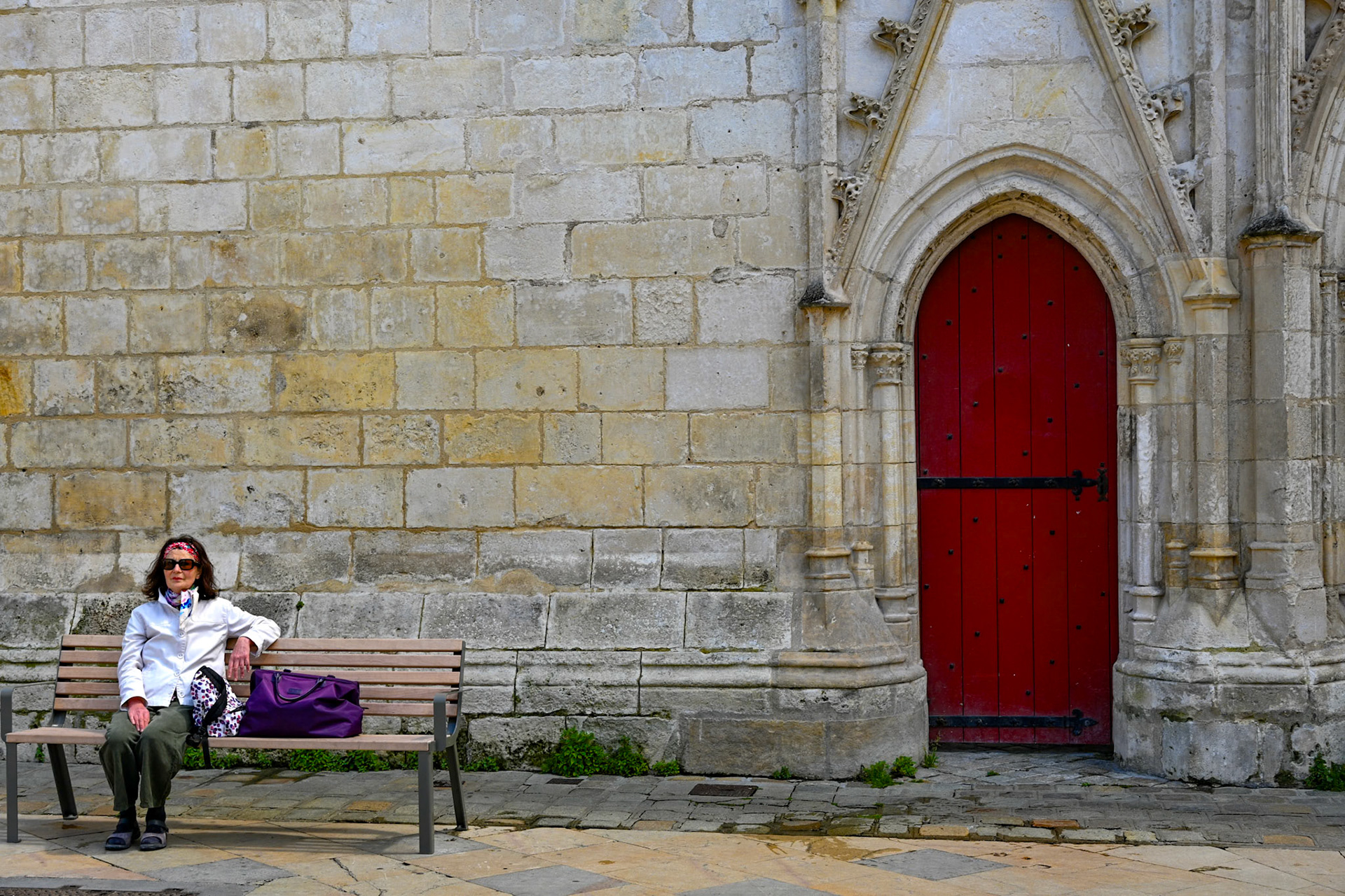 Woman waiting at the gate, La Rochelle, France