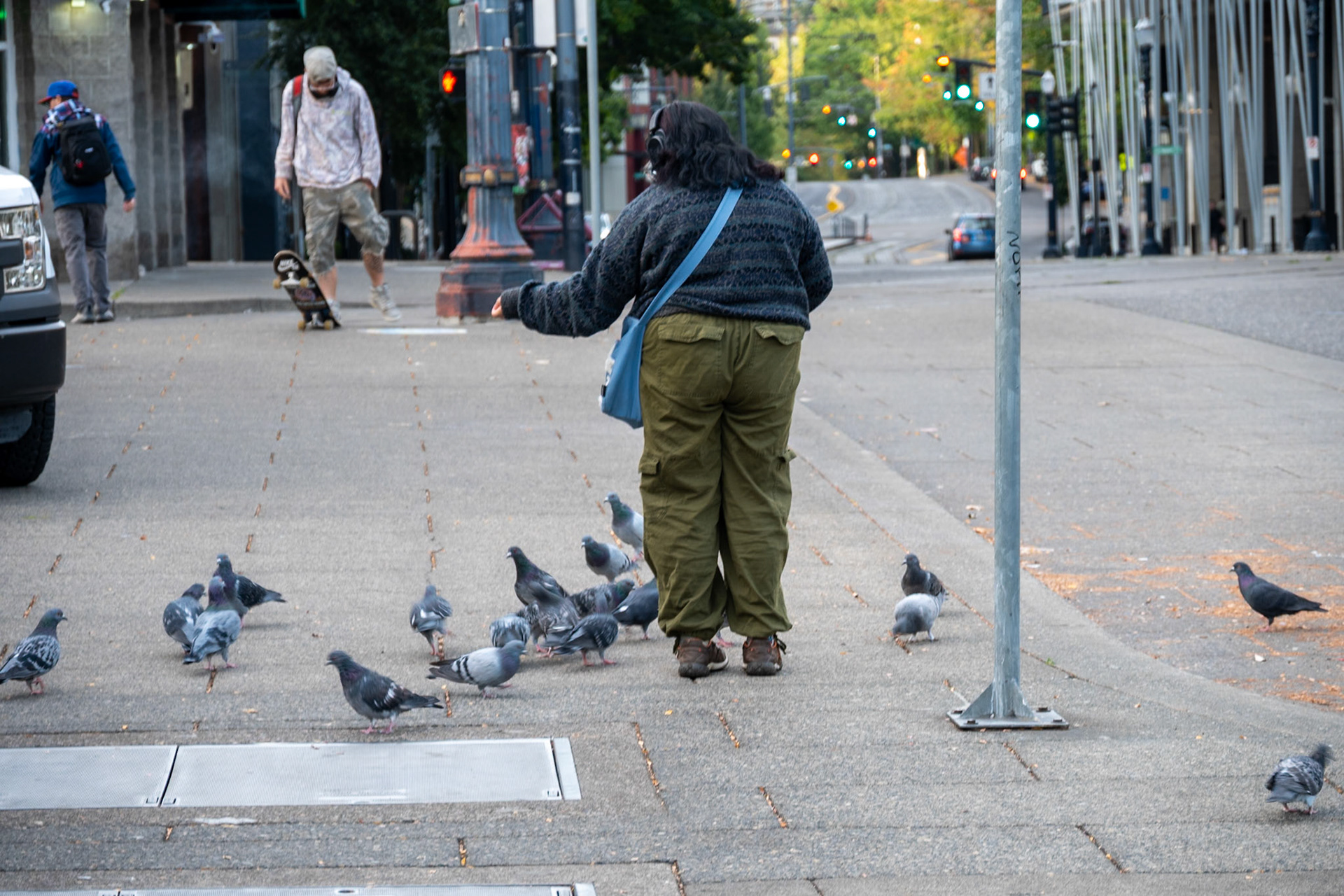 Woman feeding pigeons