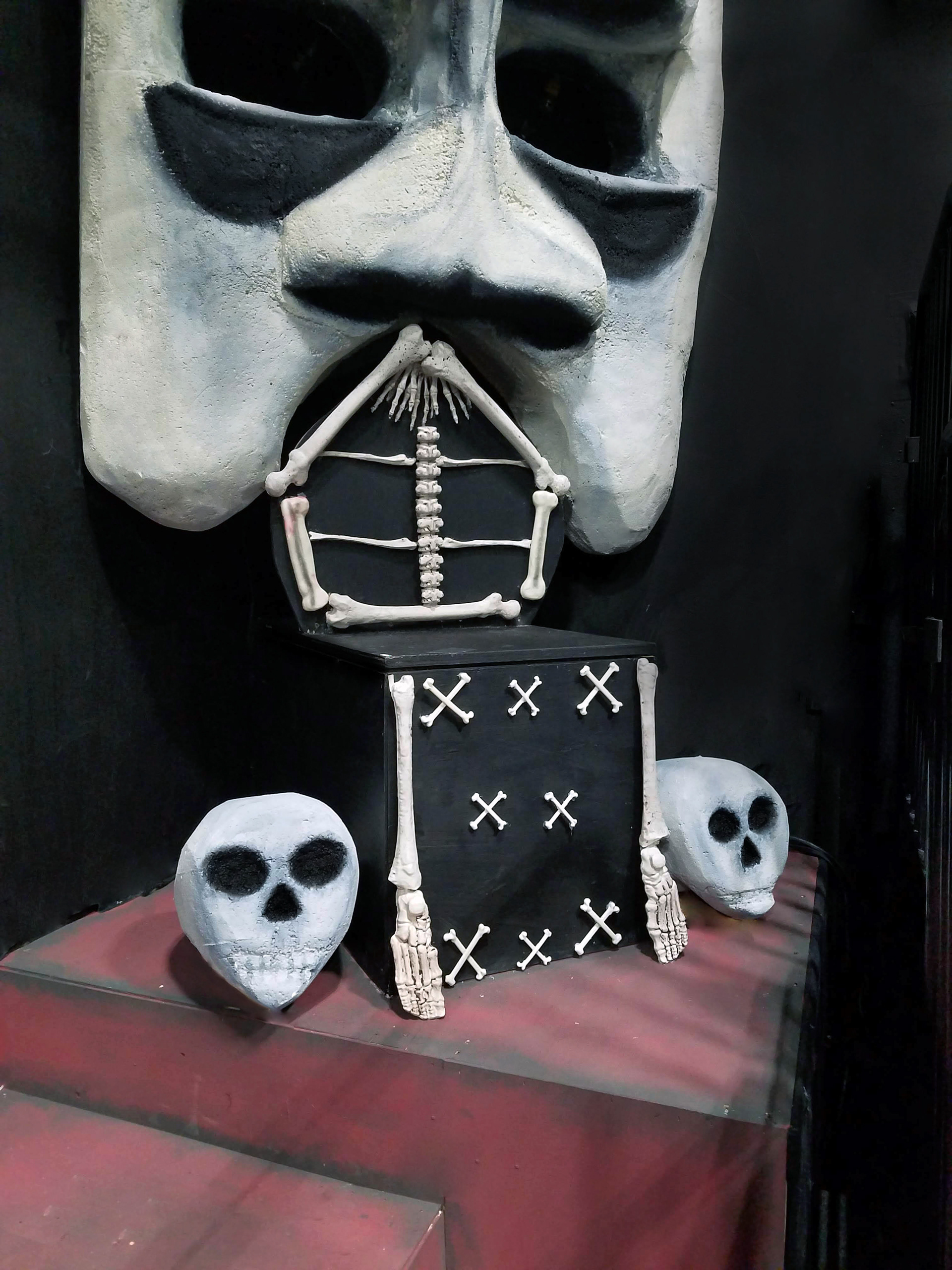 GOD OF DEATH MASK AND SKELETAL BONE THRONE WITH SKULLS