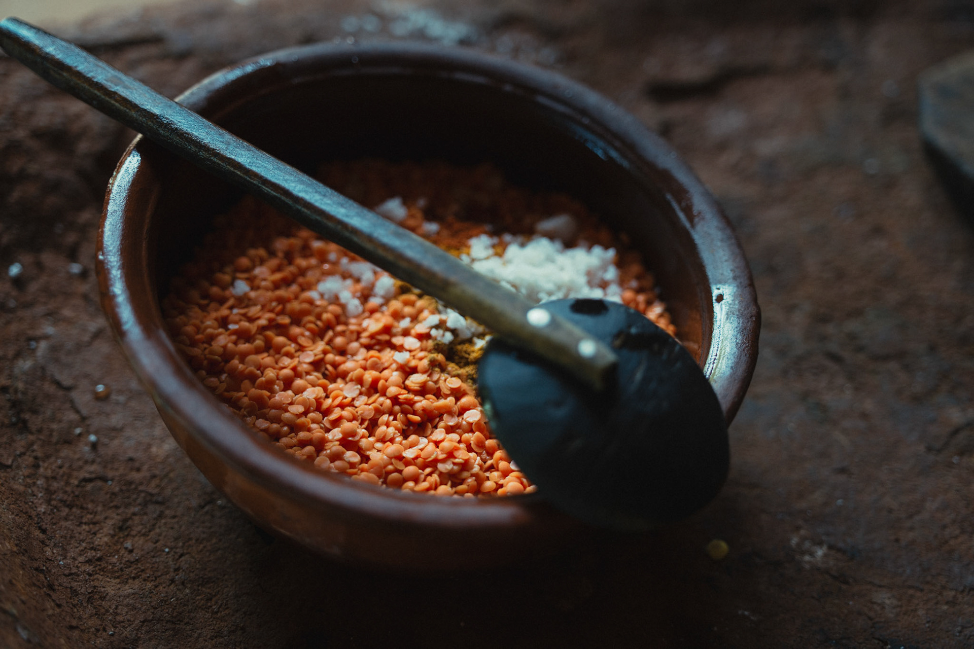 Lentils, spices, and coconut milk being prepared for a Sri Lankan dish.