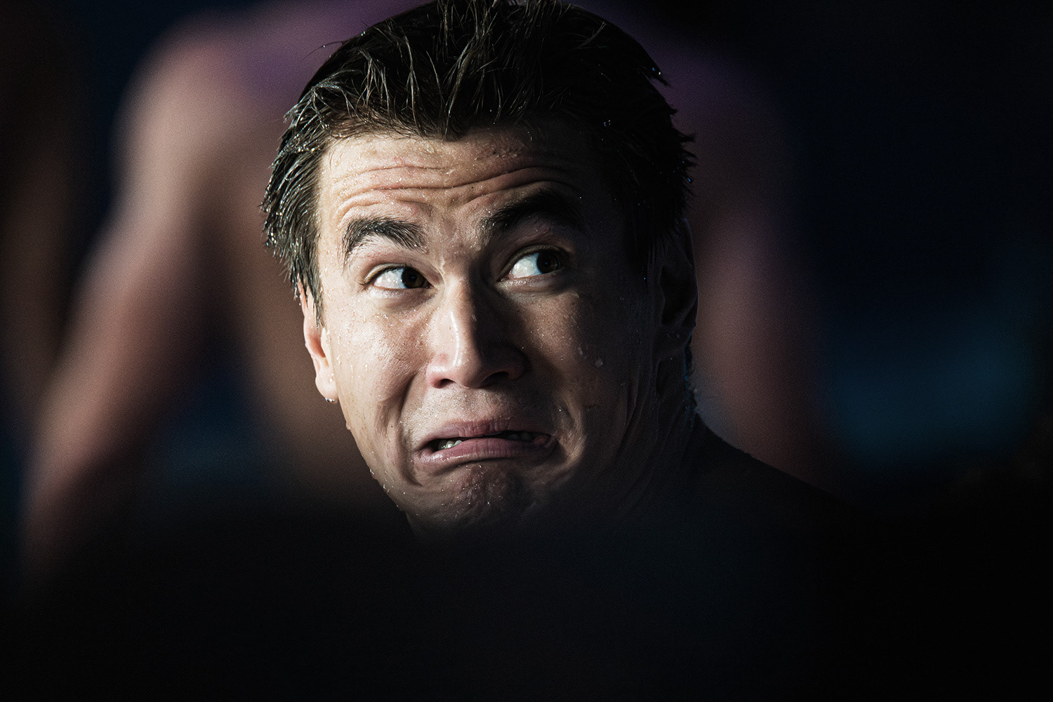 Unknown swimmer watching his competition result