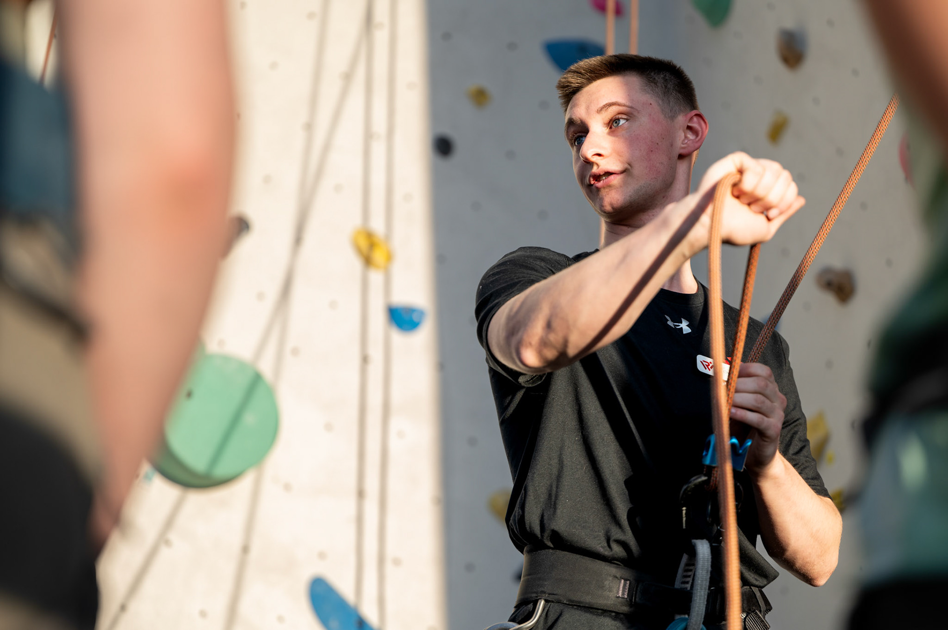 Christoper Machtel, a RecWell climbing instructor, teaches climbers how to belay during a Top Rope Belay Lesson at the Bakke Recreation &amp; Wellbeing Center’s Mt. Mendota at the University of Wisconsin-Madison on March 15, 2024. (Photo by MK Denton / UW–Madison)