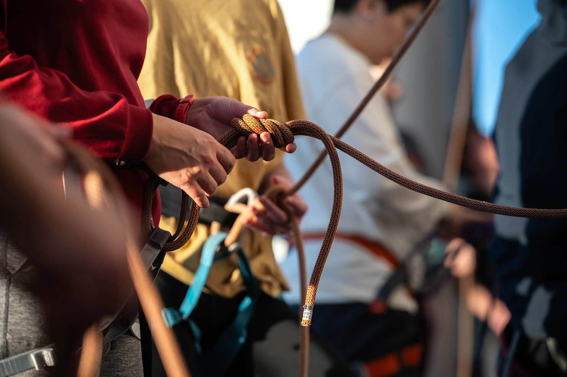 A climber learns how to tie a clove hitch during a Top Rope Belay Lesson at the Bakke Recreation &amp; Wellbeing Center’s Mt. Mendota at the University of Wisconsin-Madison on March 15, 2024. (Photo by MK Denton / UW–Madison)