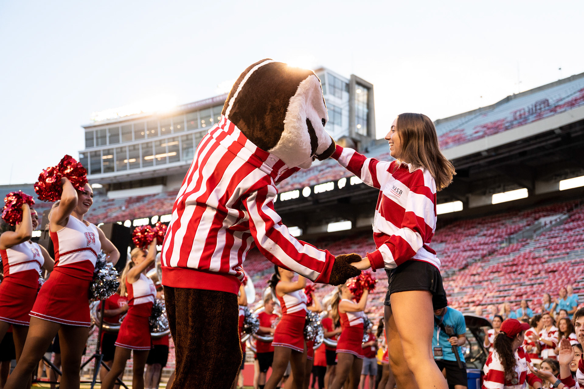 Bucky Badger dances with a WASB member during the W Project on Barry Alvarez Field at Camp Randall Stadium at the University of Wisconsin-Madison on Sept. 1, 2023. (Photo by MK Denton / UW–Madison)