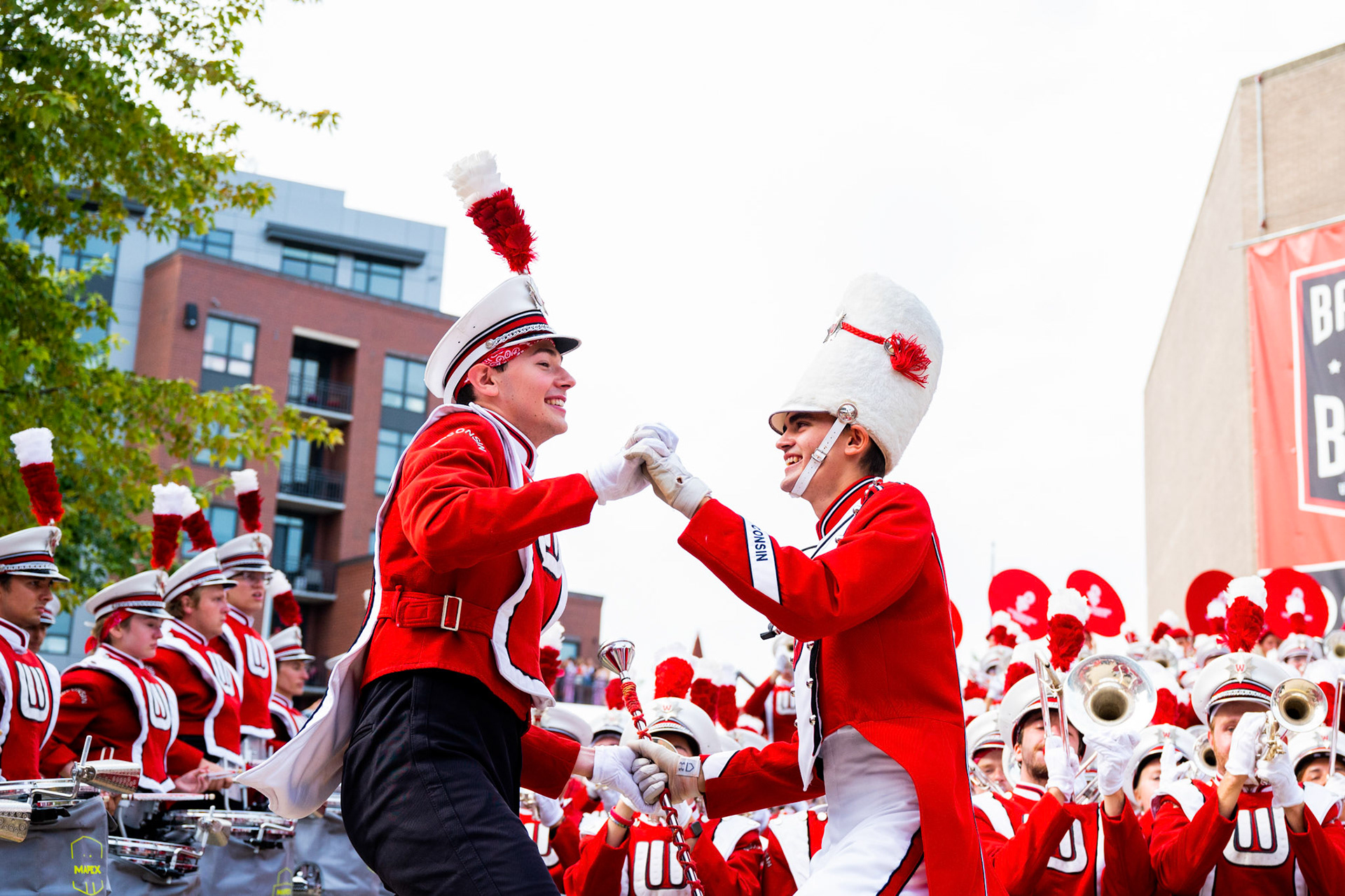 A University of Wisconsin-Madison Marching Band member dances with Drum Major Noah Fairchild during Badger Bash at Union South at the University of Wisconsin-Madison on Sept. 16, 2023. (Photo by MK Denton / UW–Madison)
