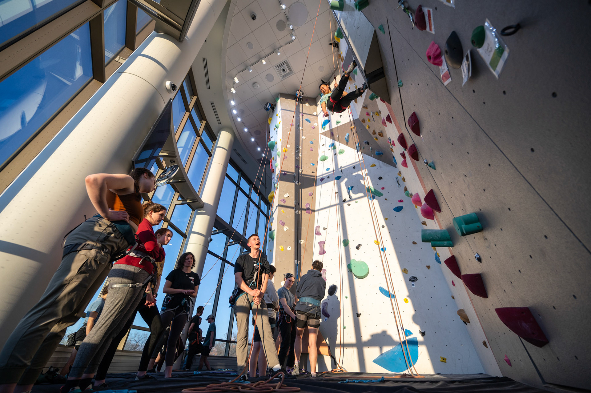 Christoper Machtel, a RecWell climbing instructor, teaches climbers how to belay during a Top Rope Belay Lesson at the Bakke Recreation &amp; Wellbeing Center’s Mt. Mendota at the University of Wisconsin-Madison on March 15, 2024. (Photo by MK Denton / UW–Madison)