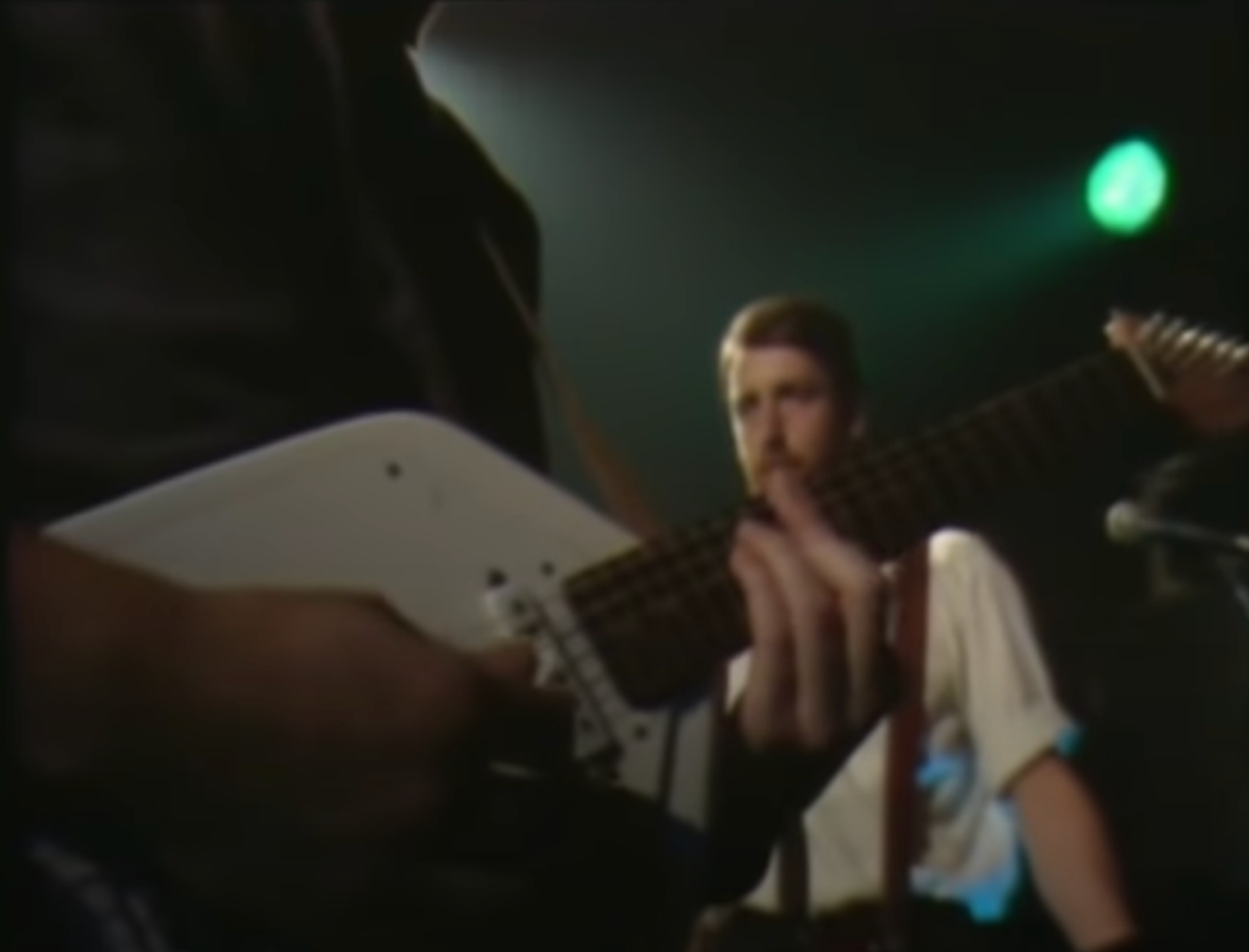 Peter Hook Vox Shot Love this image from the Taras Shevchenko video Peter Hook in the background behind the Vox played by Bernard