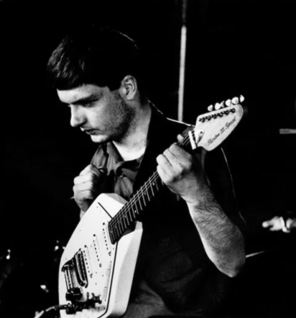 Another image of Ian Curtis with the vox guitar