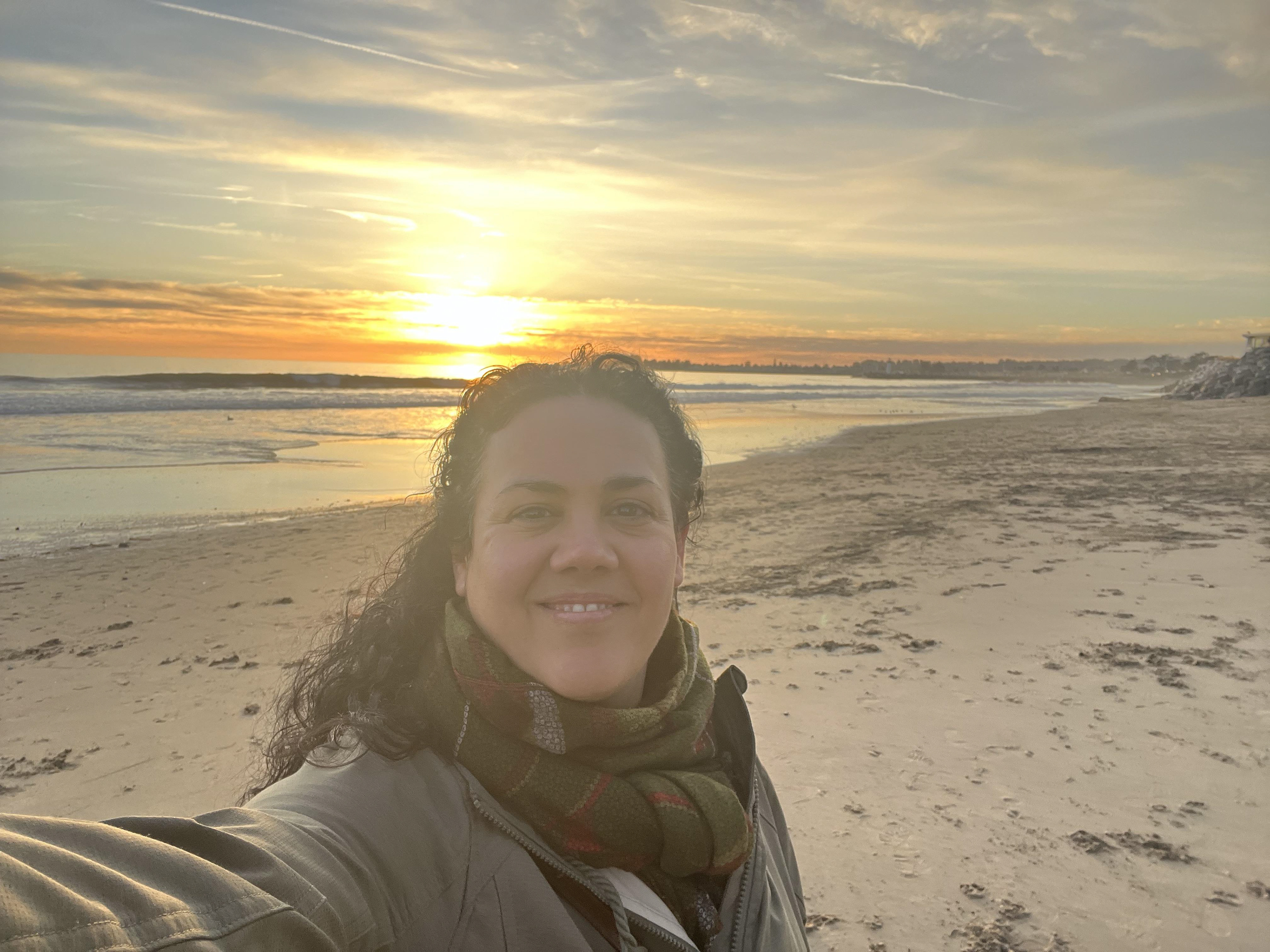 designer portrait photos on the beach sea in the background at sunset