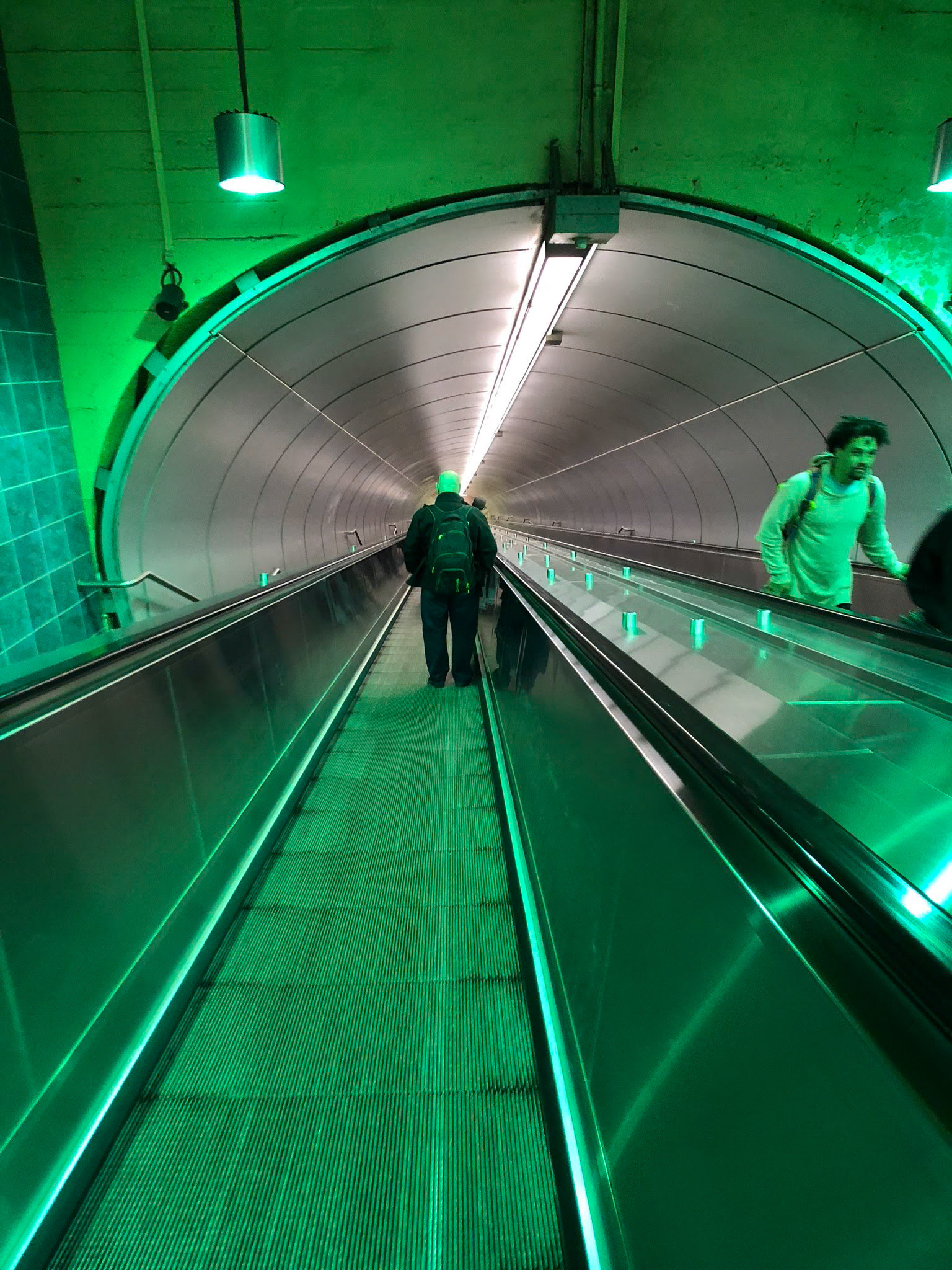 This beautiful entryway to the  metro with its green lighting looks futuristic