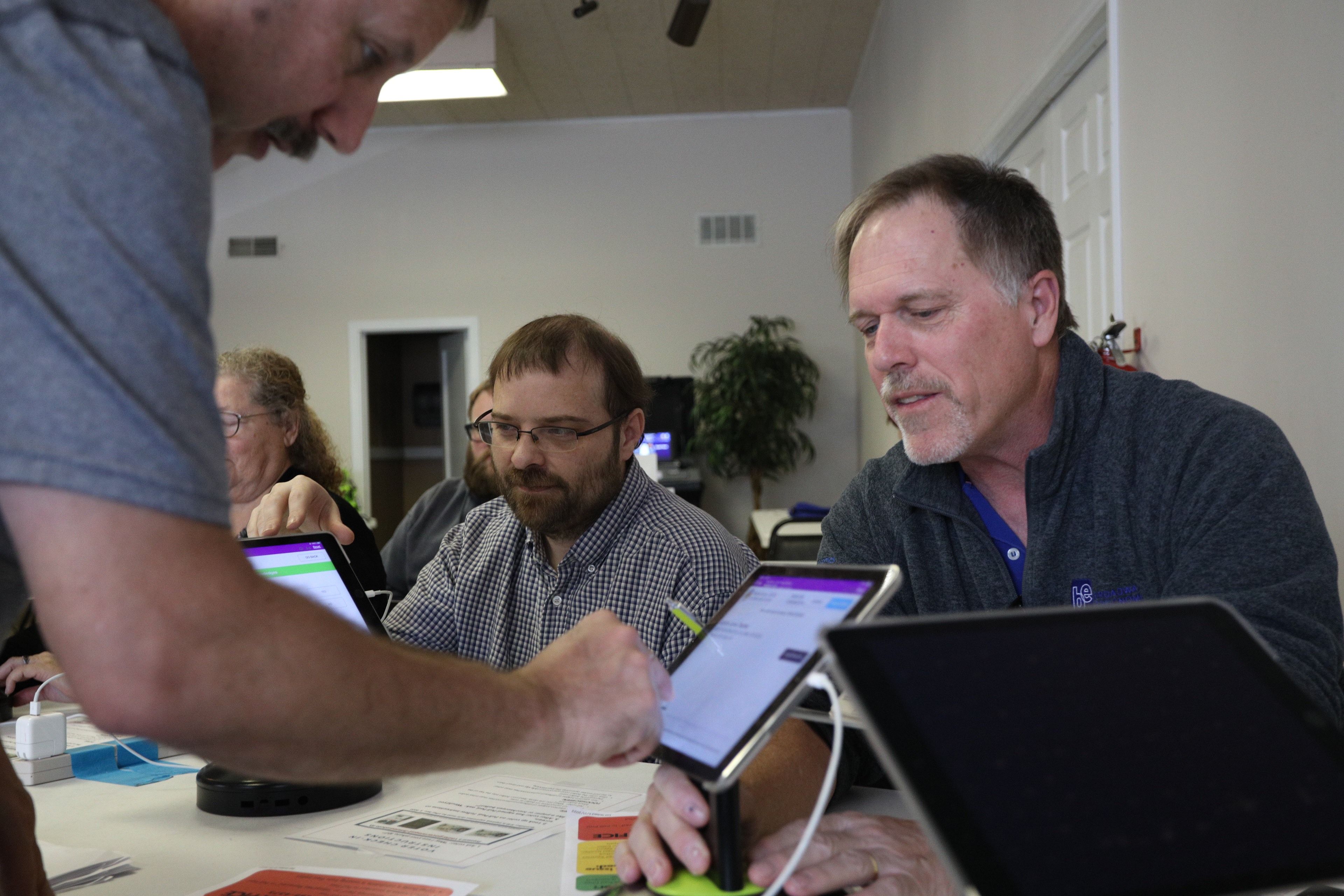 Scott Joffe (cq) instructs first time polling judges, Mitchell Toebben(left)and Bret Derrick(right) on Friday, Oct. 14, 2022 at Columbia in Boone County Polling Center. Election Day will be on Nov. 8.