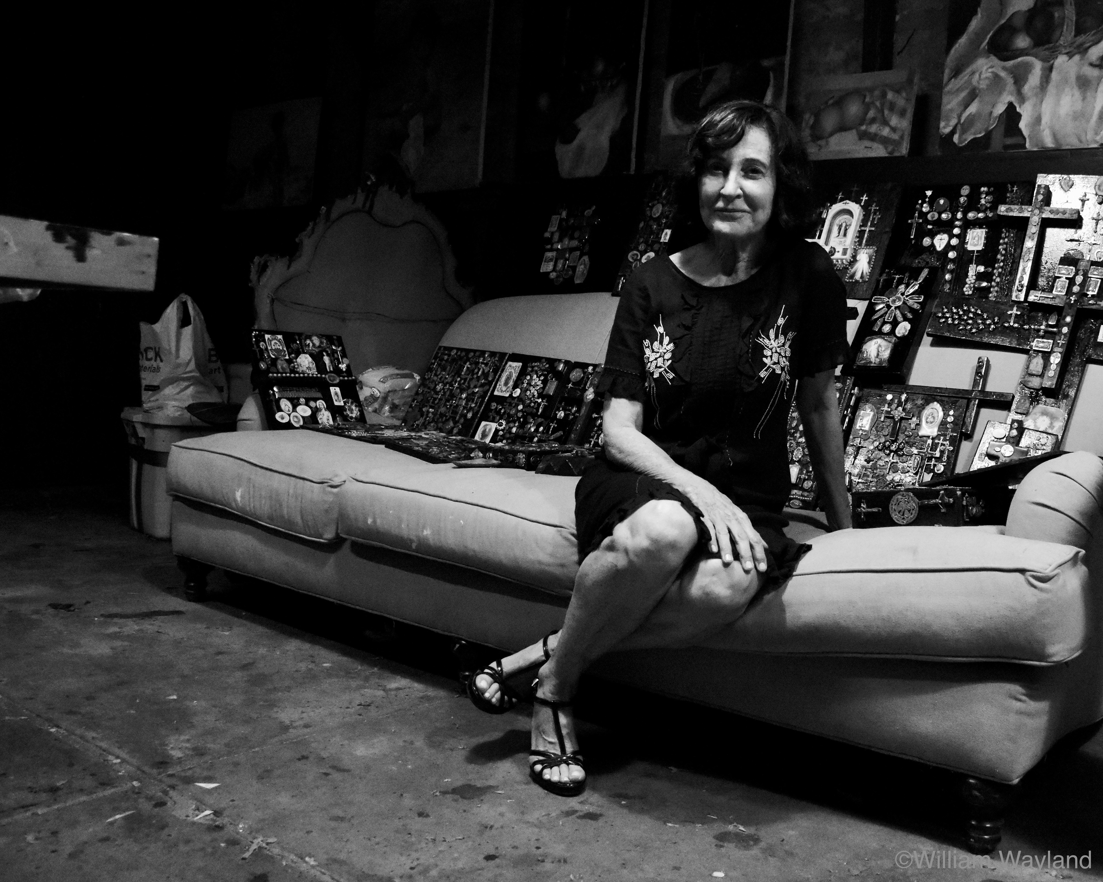 Black and white portrait of a female artist in her studio