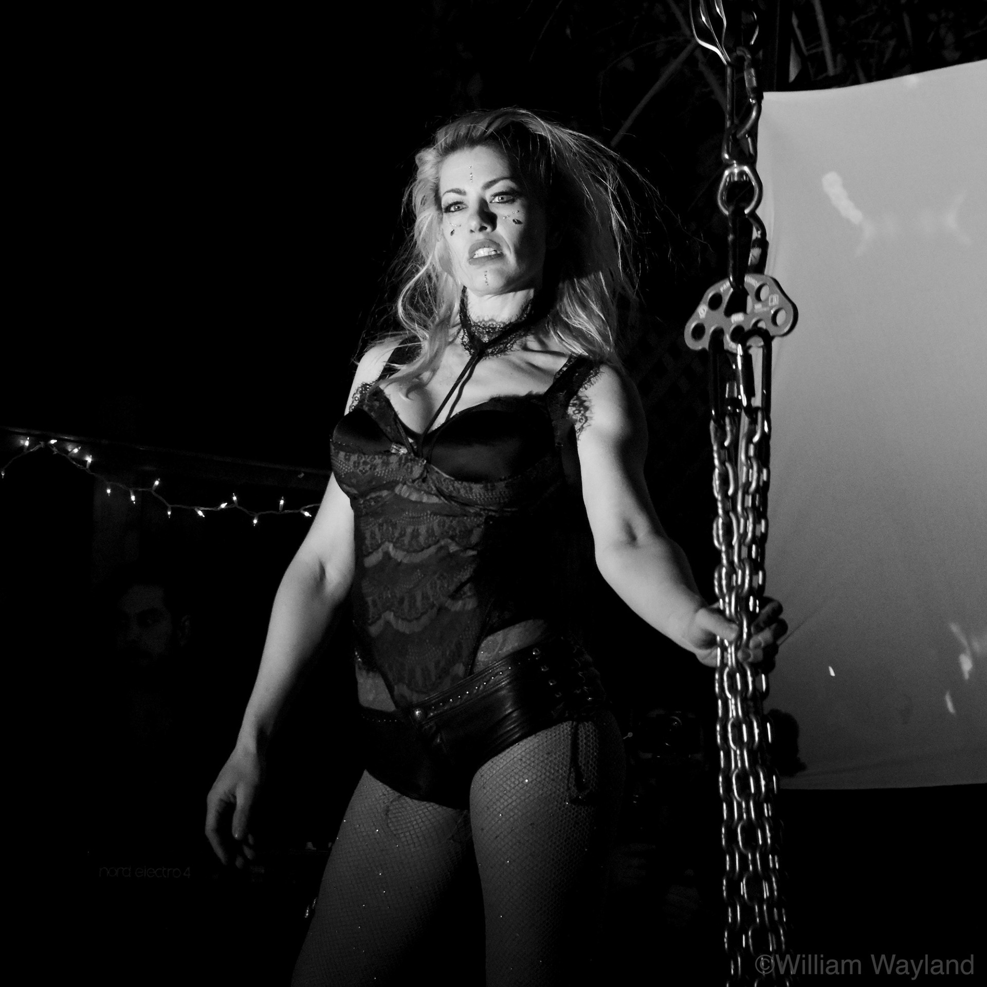 Aerialist circus performer with chains