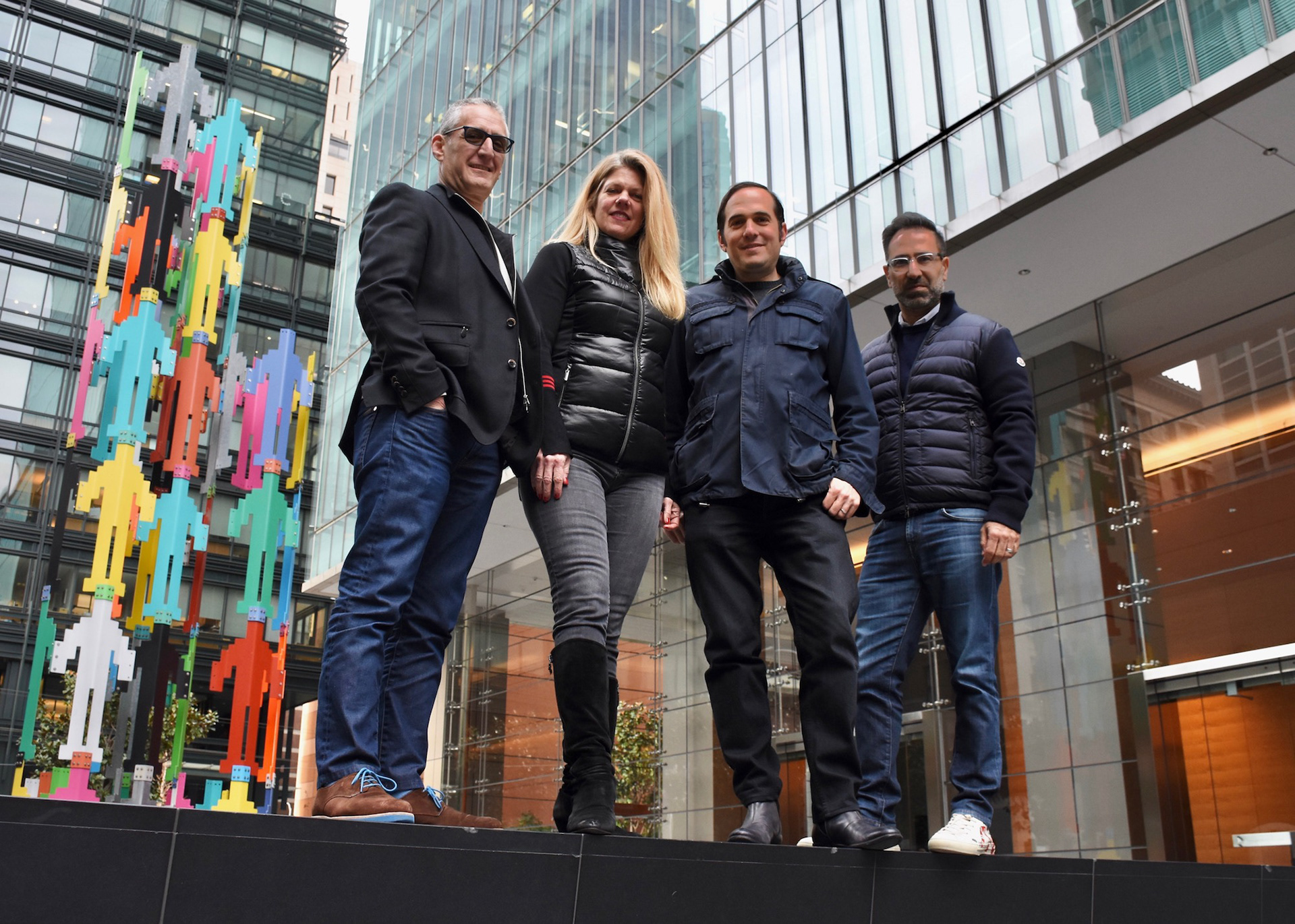 Group portrait to announce corporate acquisition