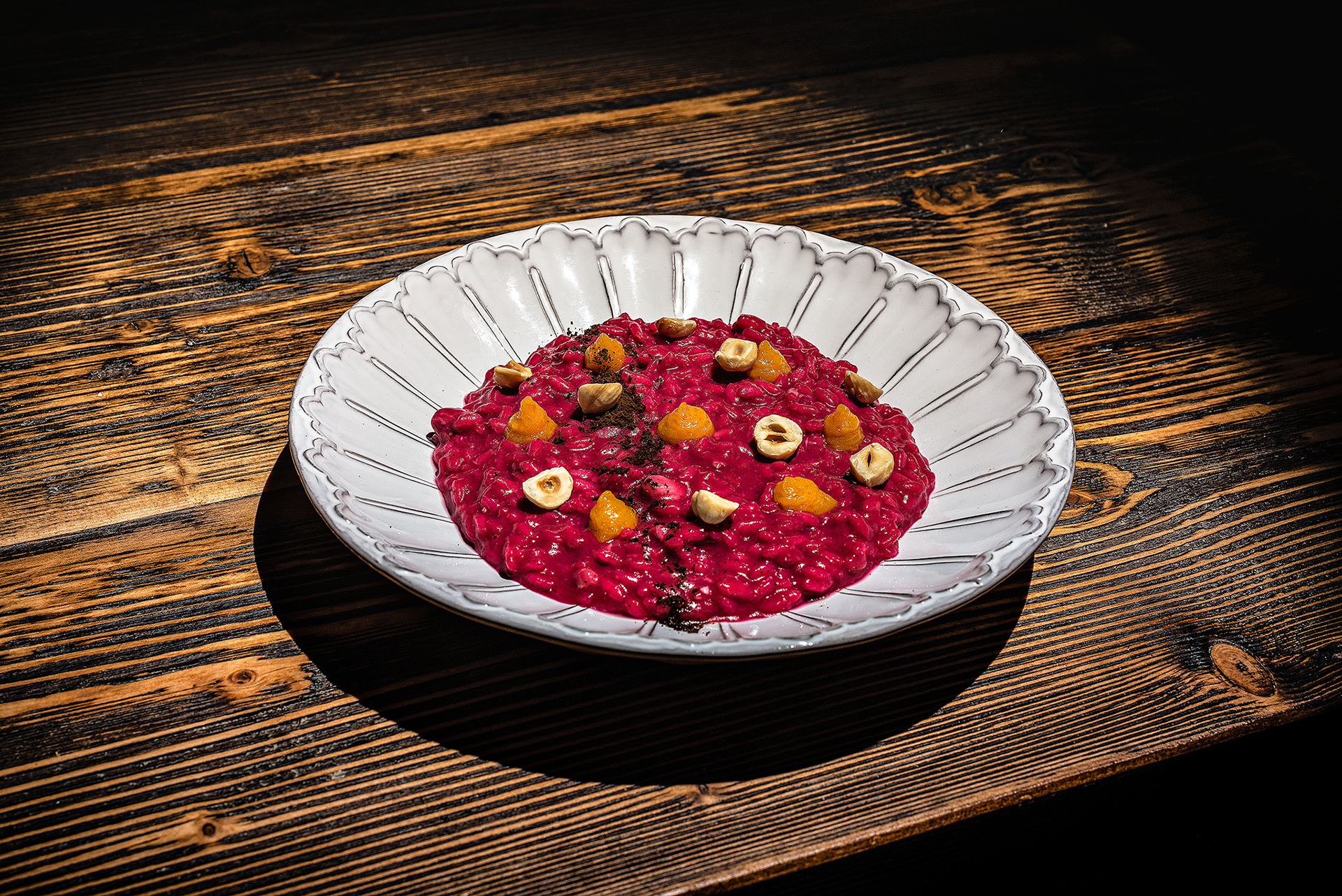 Risotto riserva San Massimo, rapa rossa, arancia, caffè e nocciola