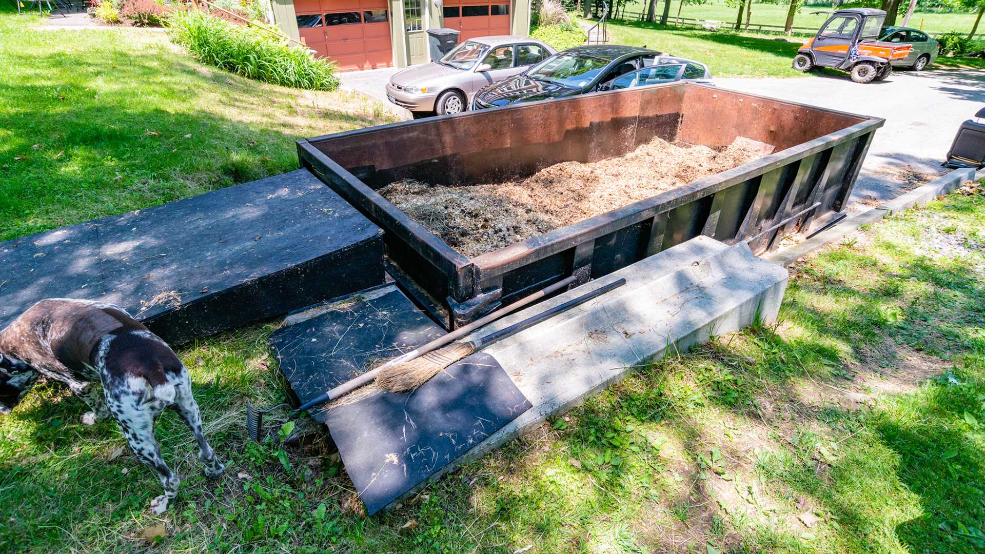 Roll off container for manure. Notch dug in hillside and lined with cement blocks. 2 of 3