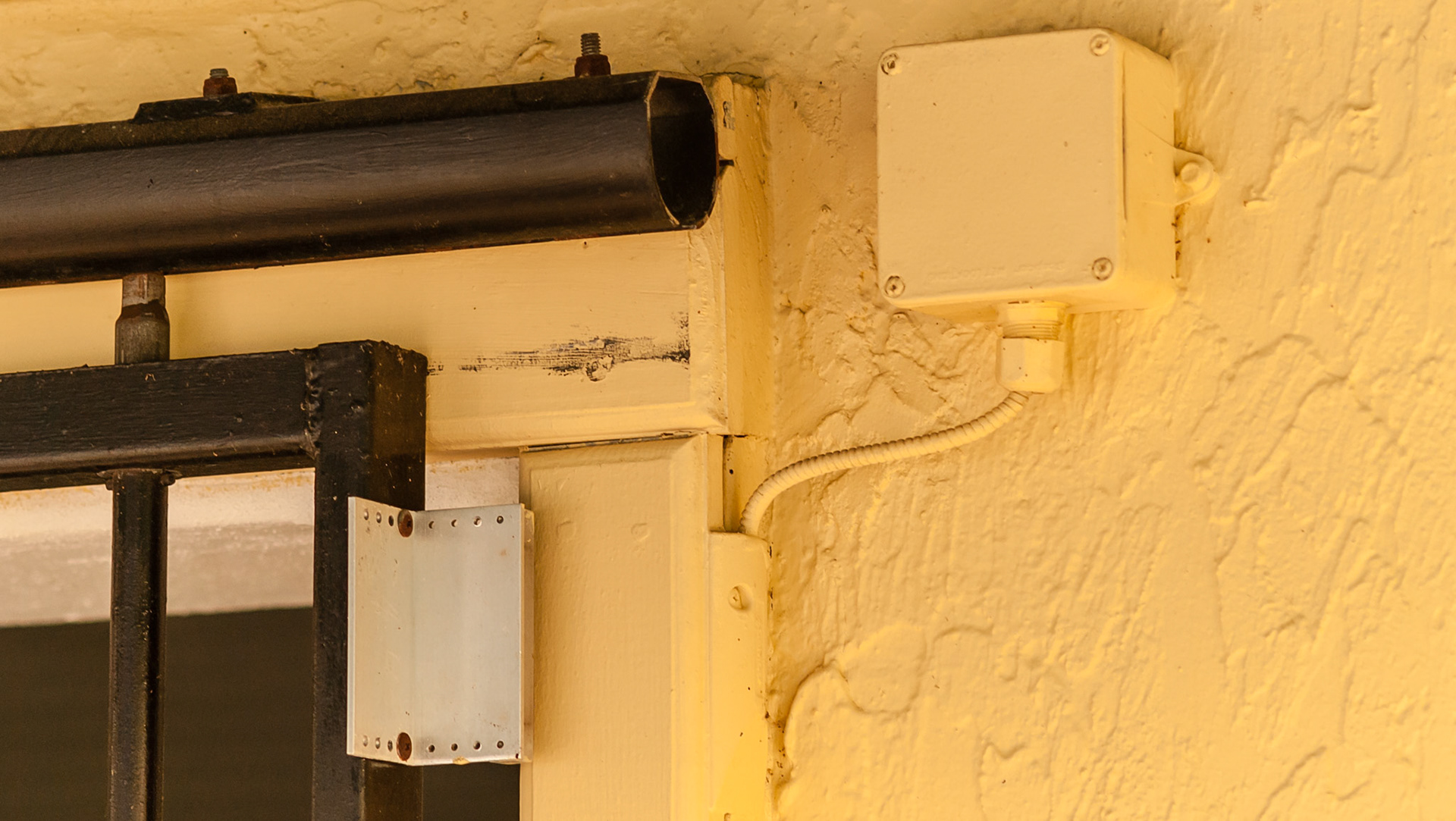 This open stall door opens a sensor to indicate that the door is open