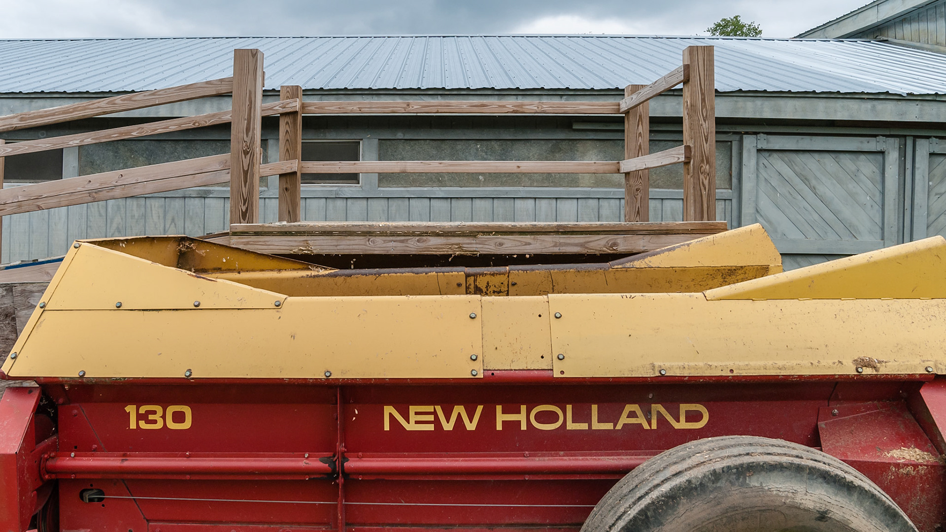 This dumping platform is at a good height and has a bumper to prevent a slight miss but carfeul alignment of the spreader is essential.and snow may raise it too high.