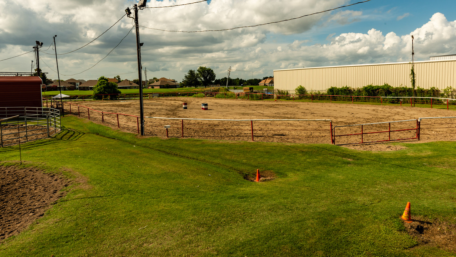 Outdoor arena with pipe fencing. This barn is in the middle of an industrial zone where used pipe is abundant