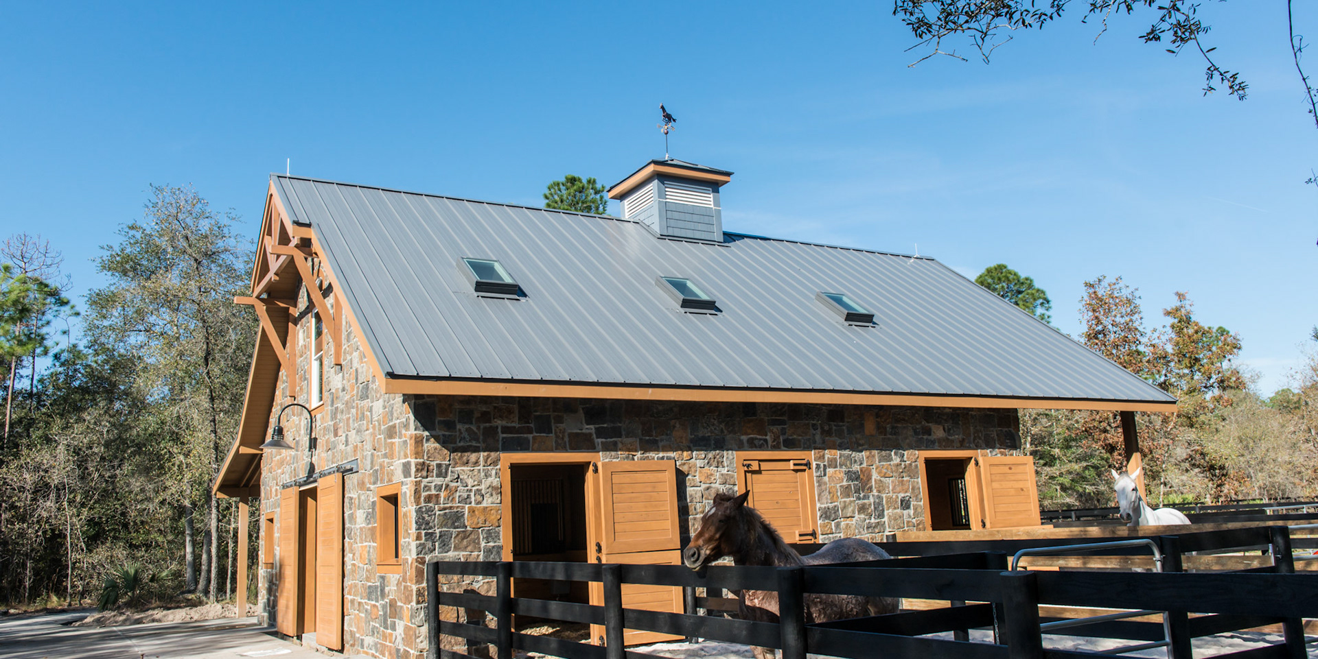 Small turn-outs allow the horse to walk in and out of their stalls during inclement weather.
