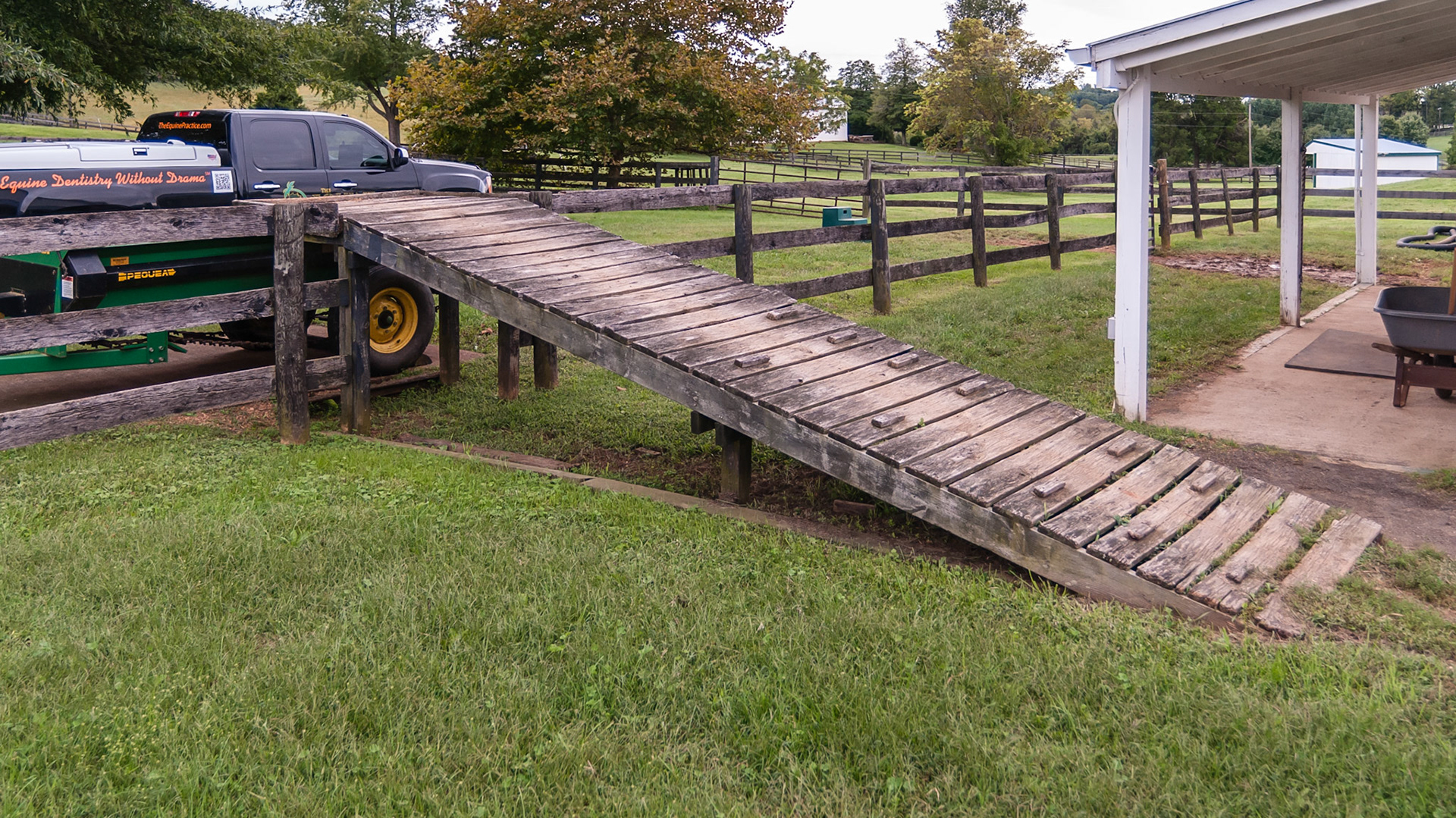 A simple ramp with a steep grade, no guard rails, poor traction and a short platform. However the spreader can be placed underneath the platform to reduce spillage.