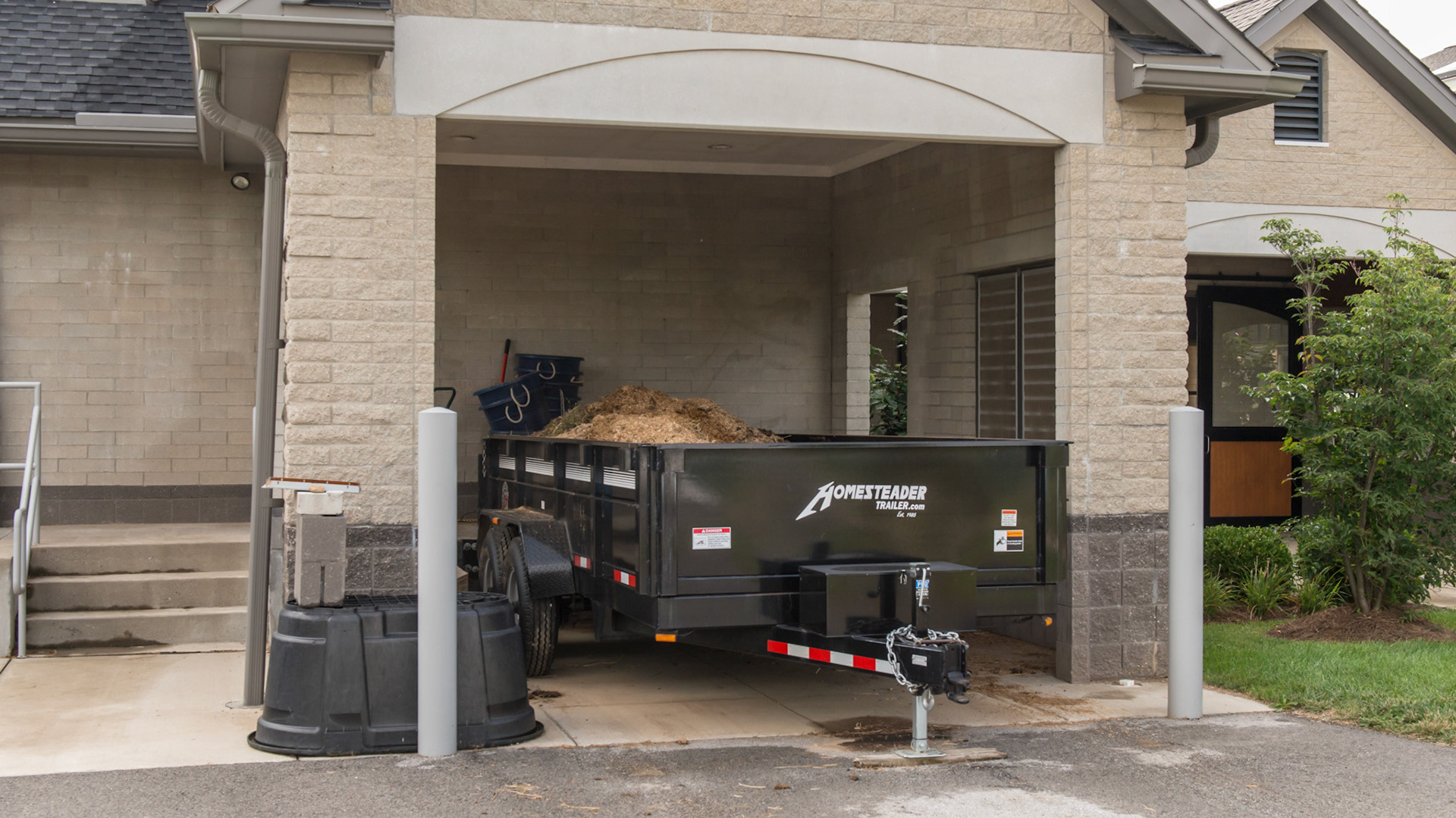 A covered loading dock for manure loading of the dump wagon. 1 of 2