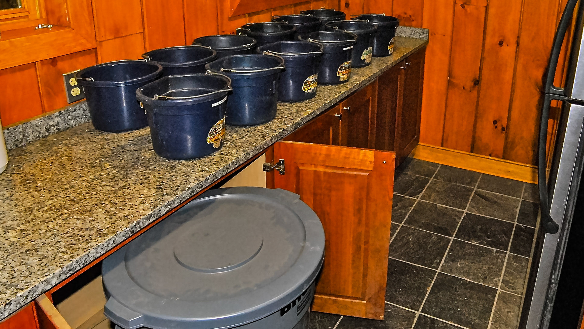 The feed containers are on rollers and tuck away into cabinets.