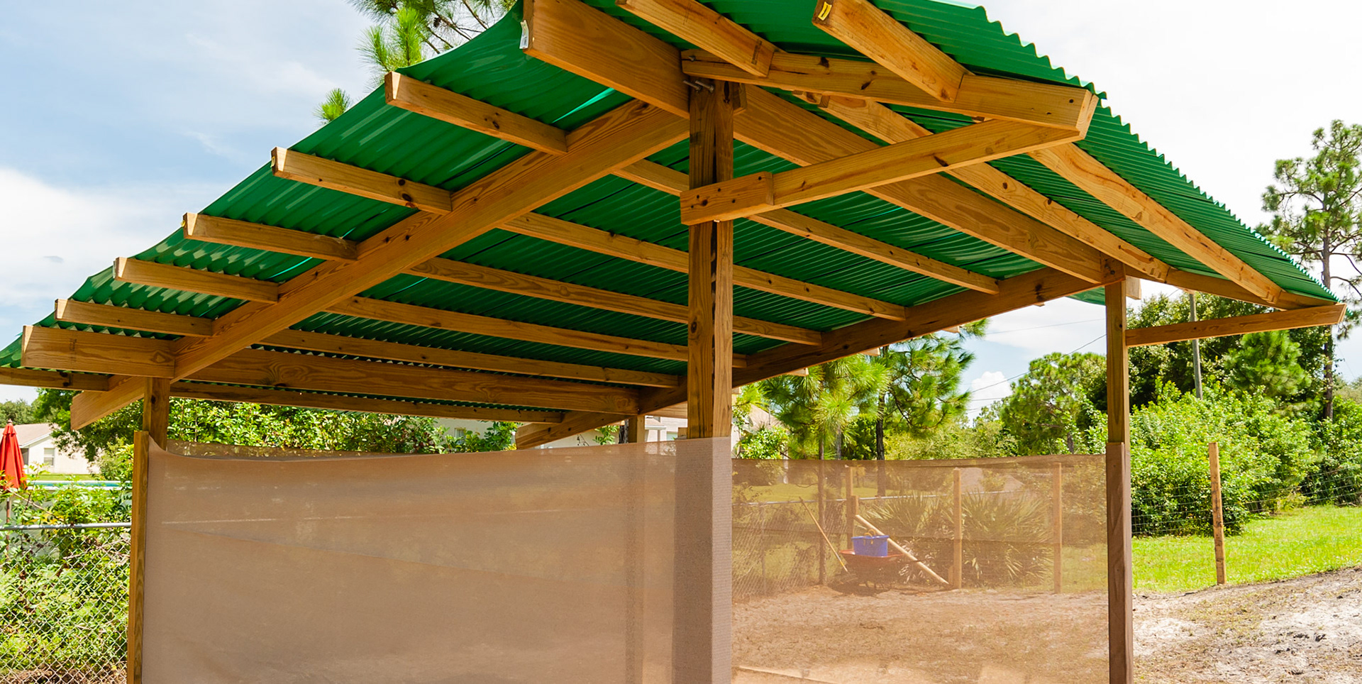 Simple construction, a plastic roof and sides made of sus screen cloth gives shade plus ventilation.