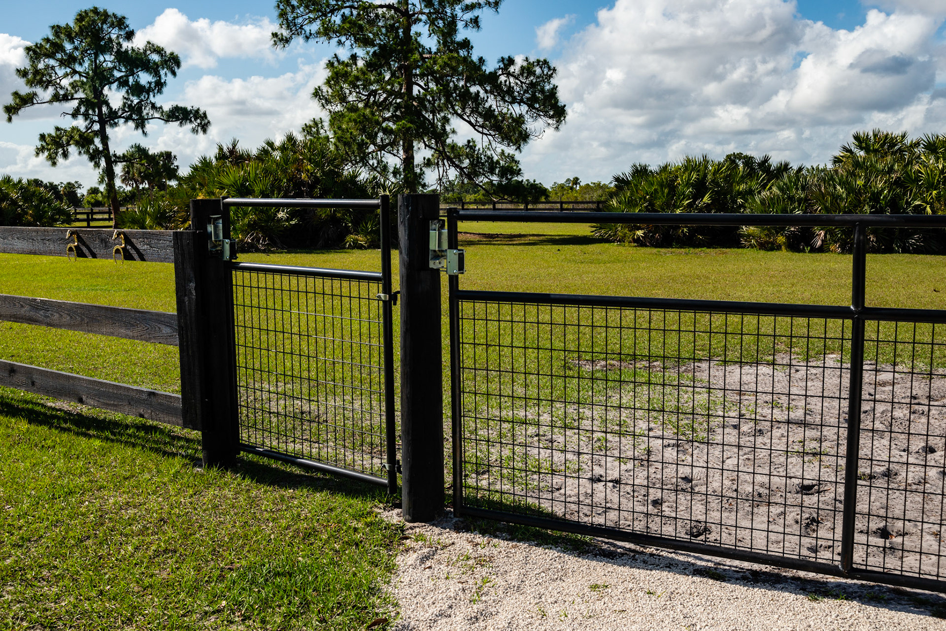 A gate for horses and a gate for humans may be redundant.  The hinge hooks are set correctly so the gate can't come off.  The latches allow for the gate to swing either way and close automatically.  There are 2 brass tack hooks for hanging halters and leads.