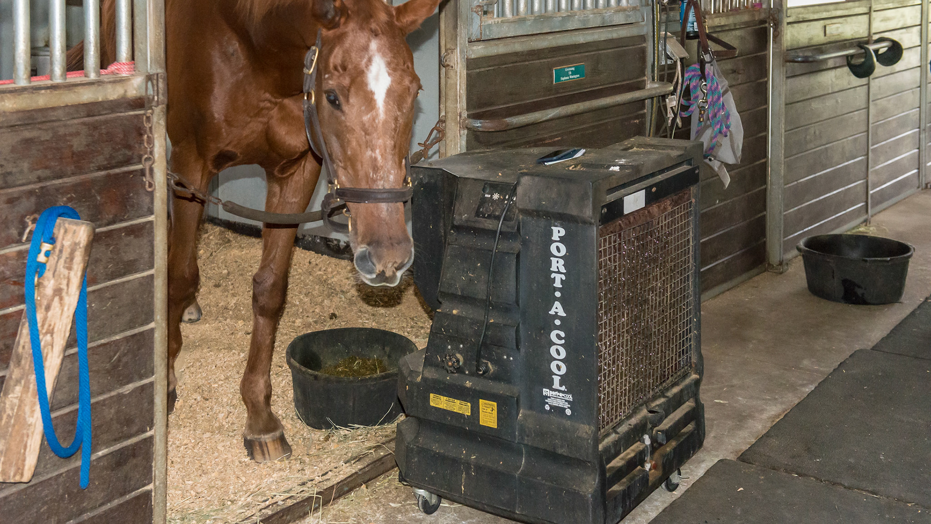 A small Port-a-cool fan using water soaked paper readiator elements where the fan evaporates the water cooling the exhausting air.