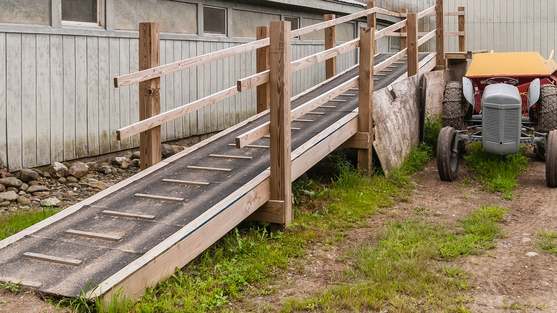 Gentle slope, traction blocks and a railing make this ramp a safe and effective way to approach this dump platform, except dueing snow or ice.