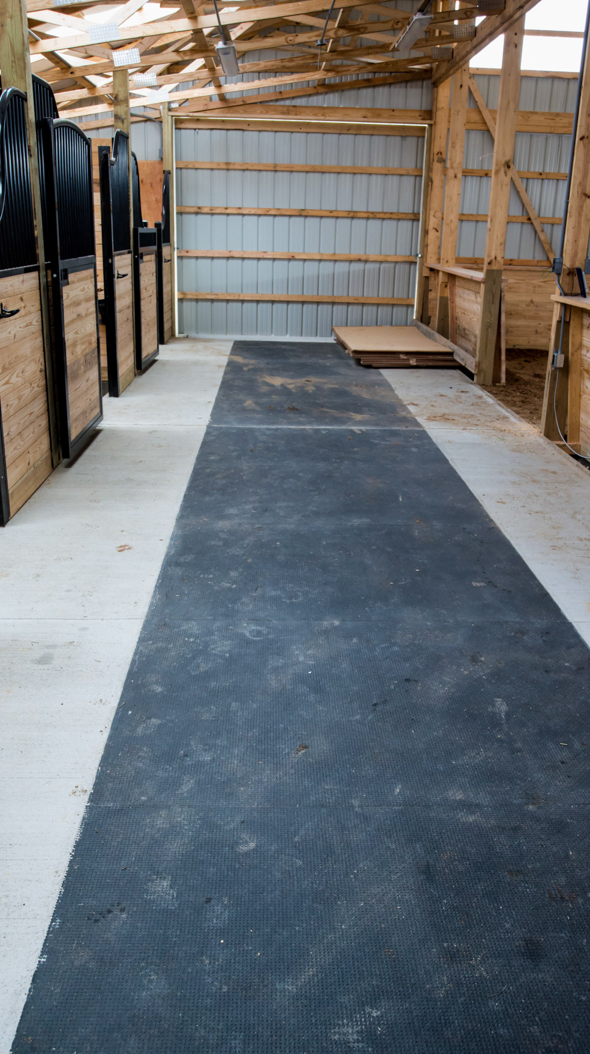 Rubber mats are laid in a cement frame.