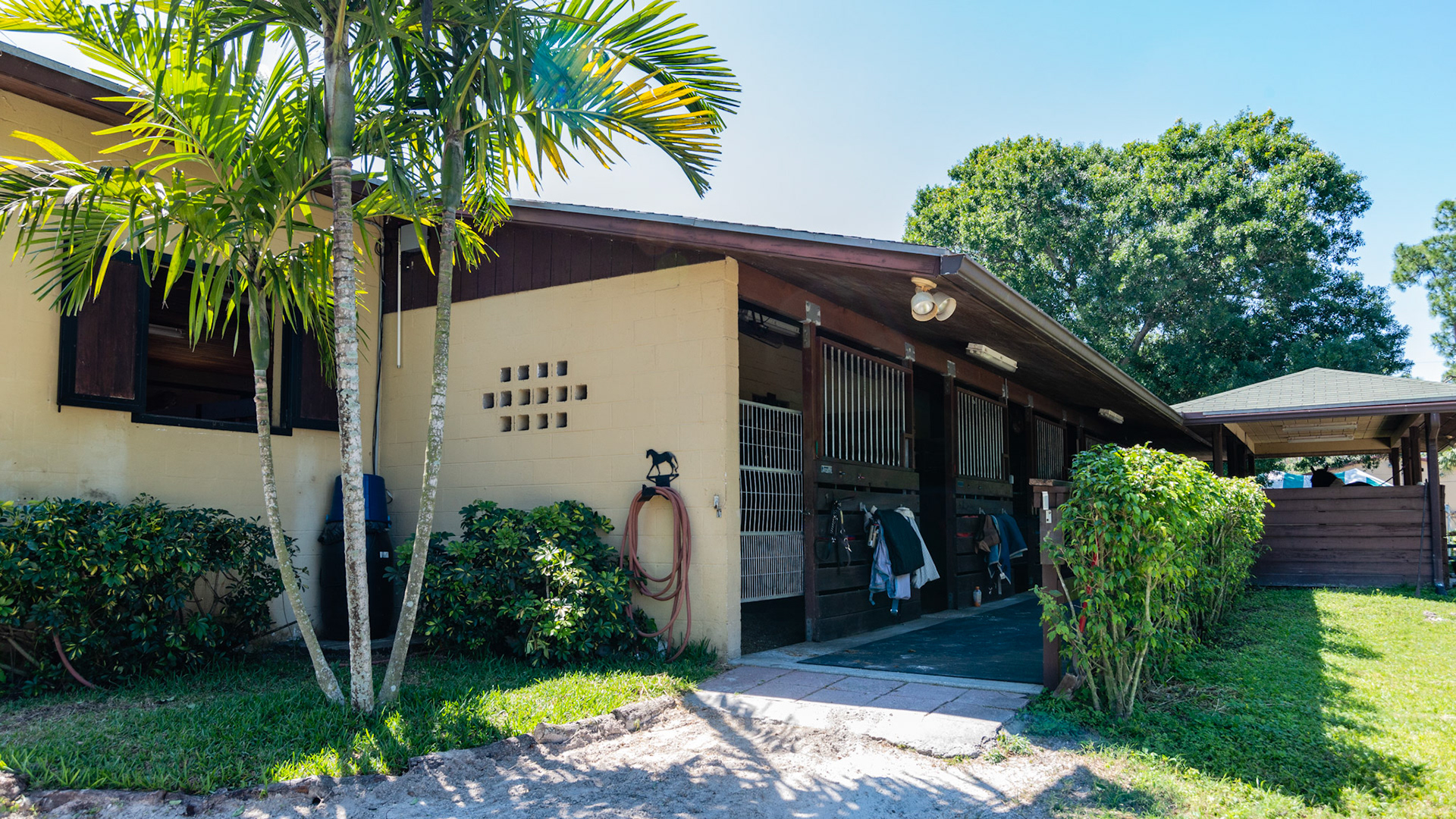 Loxahatchee, FL barn.  The stalls face the outside.