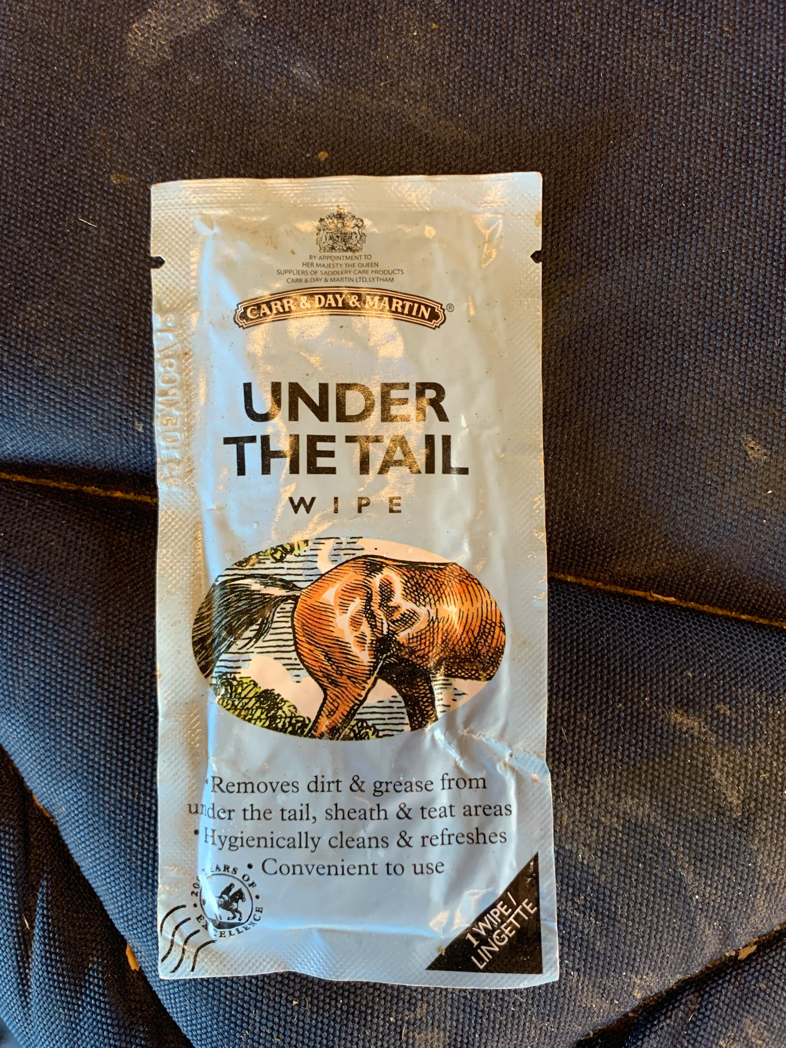 A packaged wipe for cleaning under the tail.