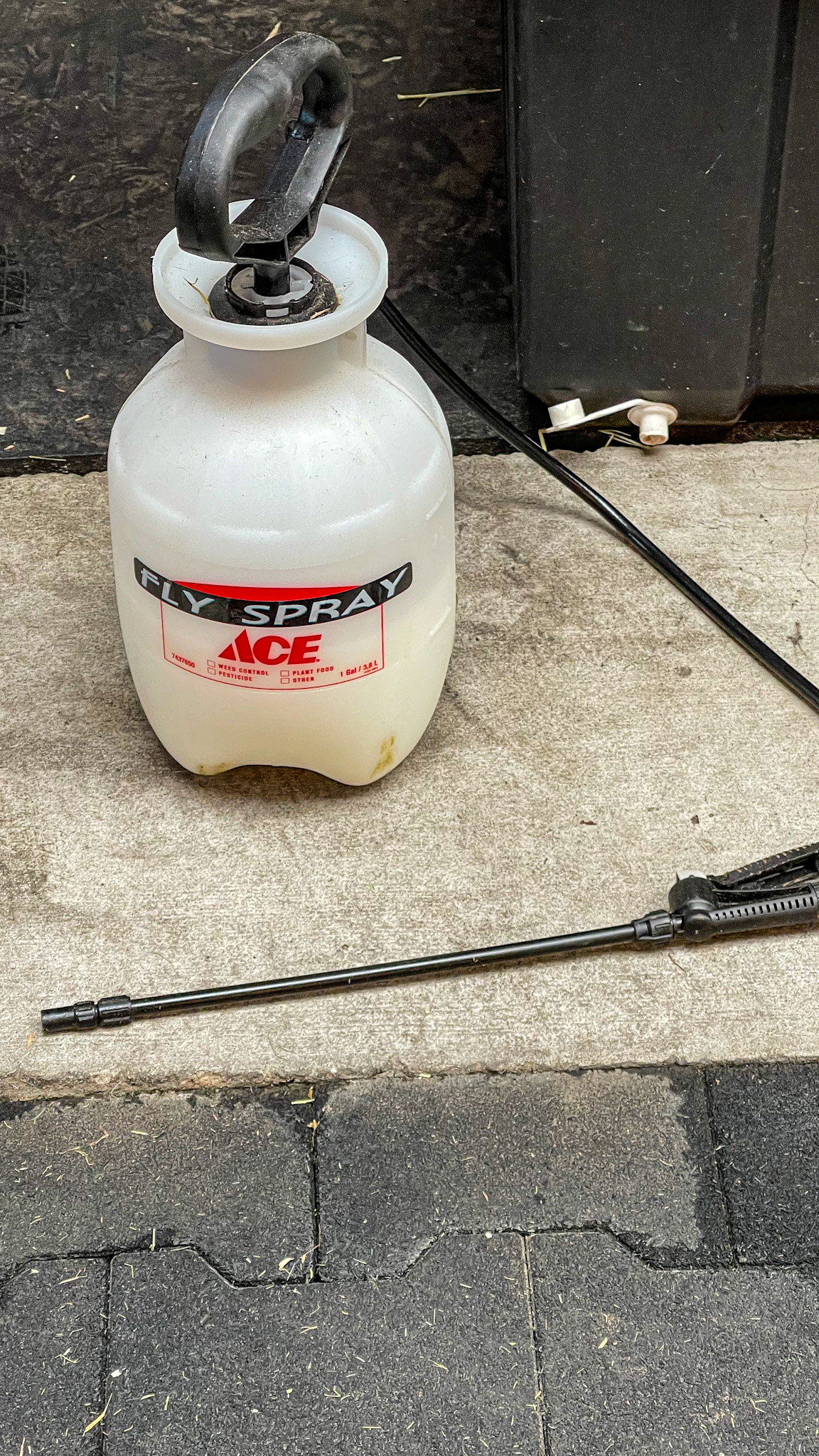 A hand pump for spraying fly control around the barn.